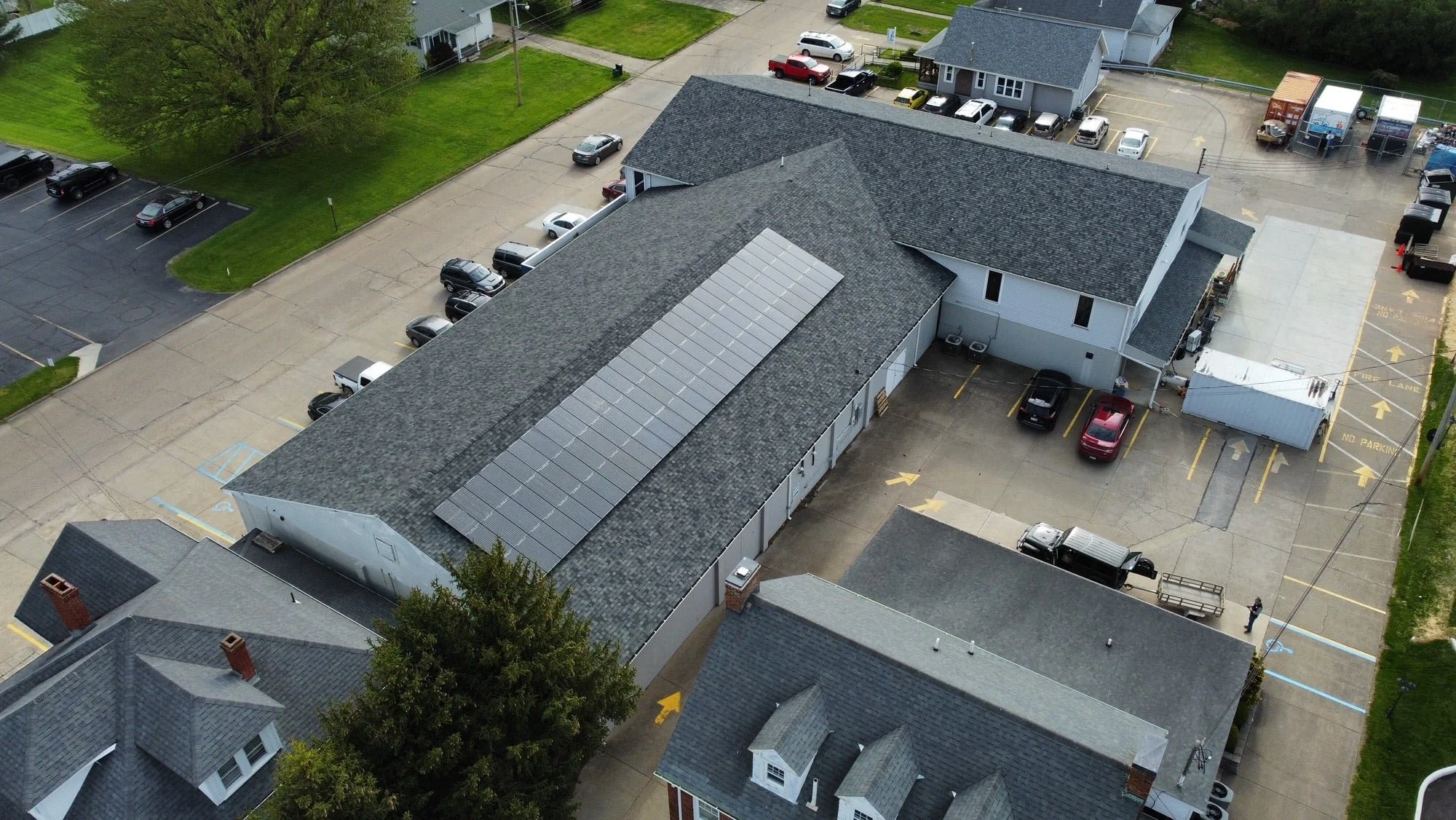 aerial view of a solar array on the gray roof of a Habitat for Humanity Restore