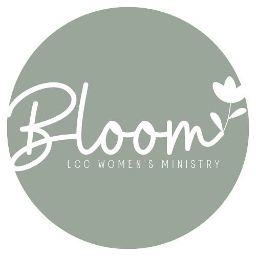 A circular logo with a muted green background. The word 'Bloom' is written in white, cursive font with a small leaf extending from the last letter. Below, it says 'LCC WOMEN'S MINISTRY' in smaller uppercase letters.