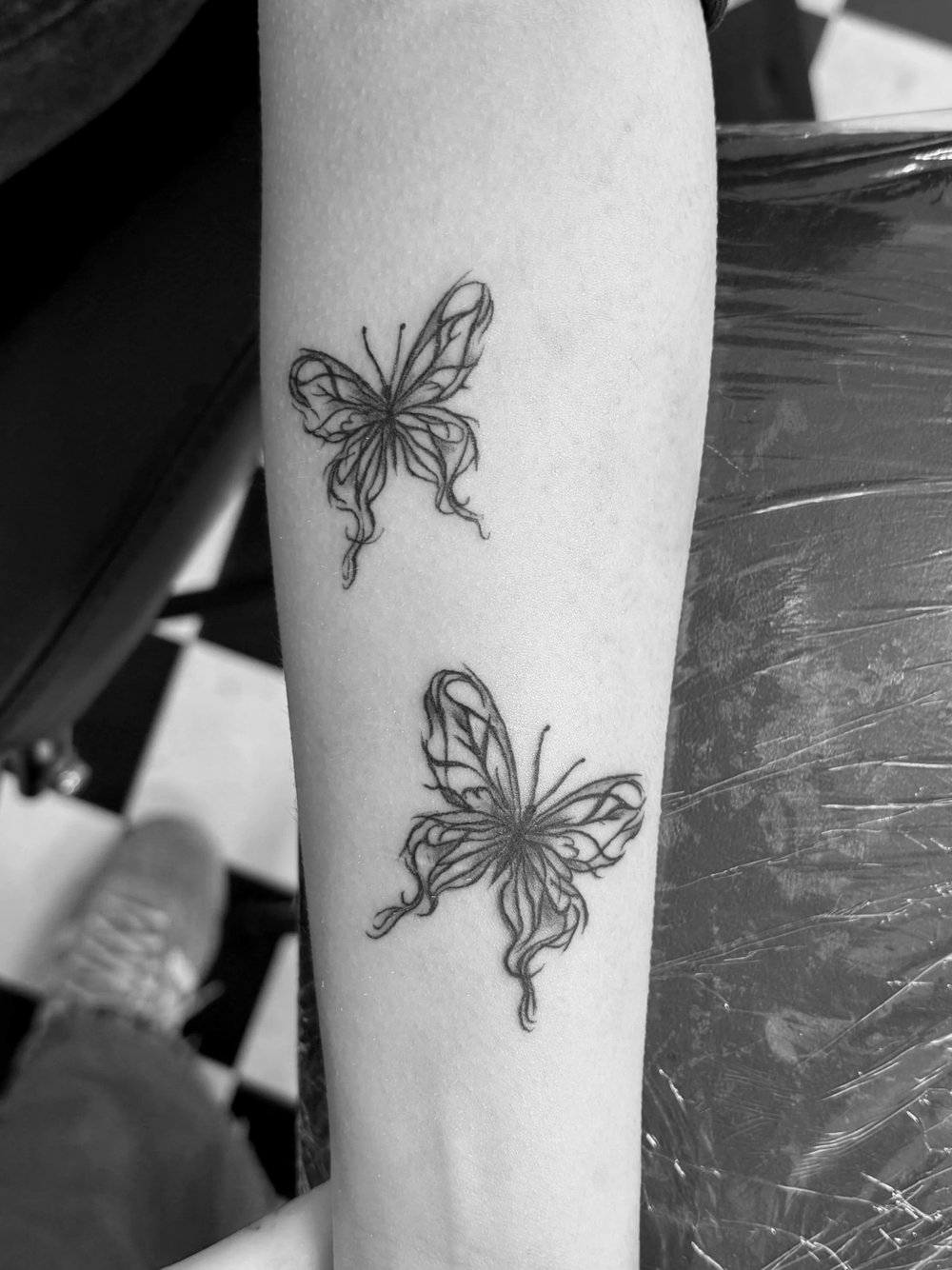 Butterfly tattoos on a forearm