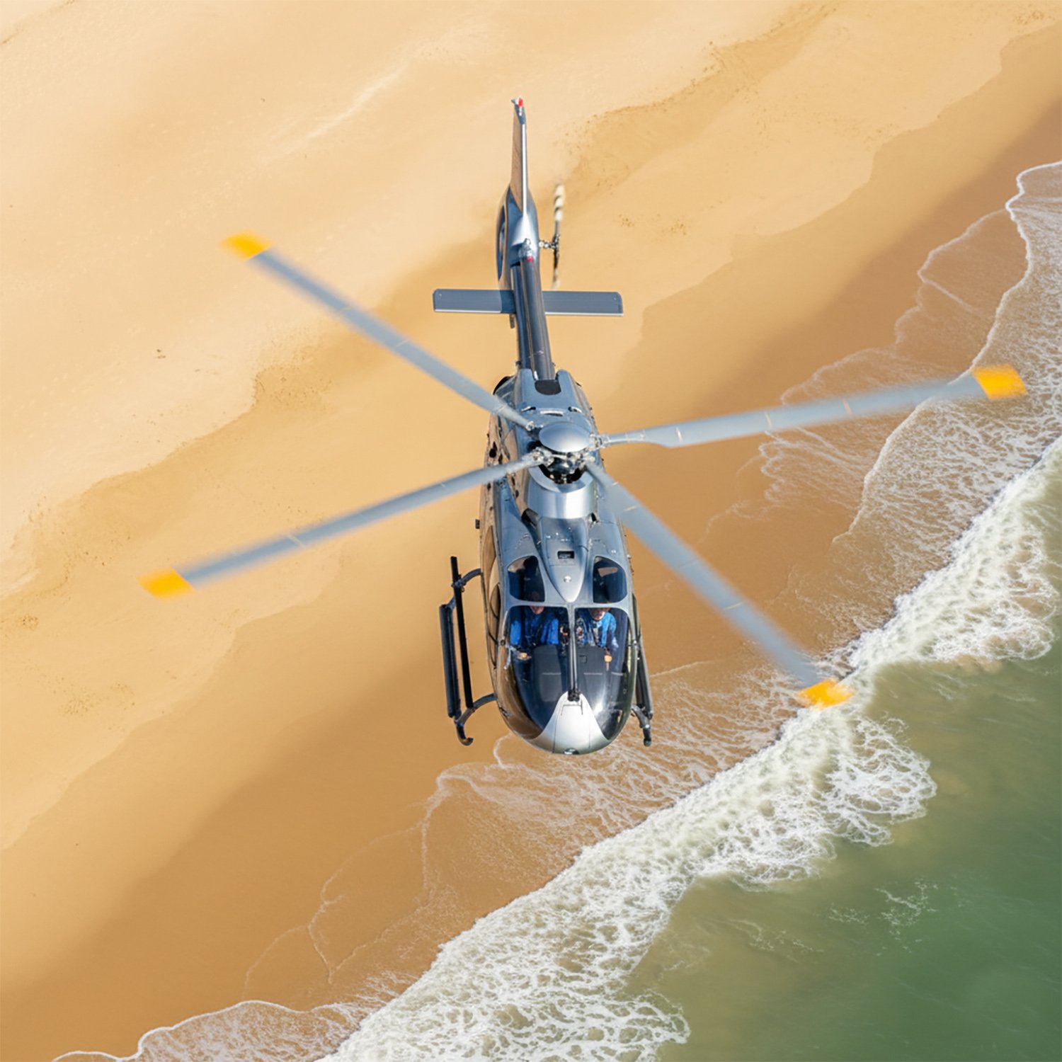 Altair helicopter flying over Sandbanks Dorset.