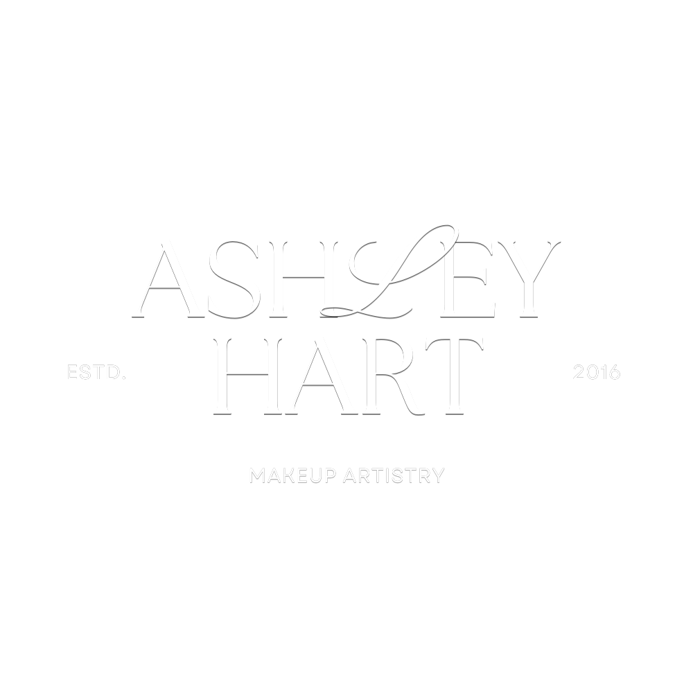 A black background with white elegant text displaying the name 'Ashley L. Hey Hart,' established in 2016, and the tagline 'Makeup Artistry.'