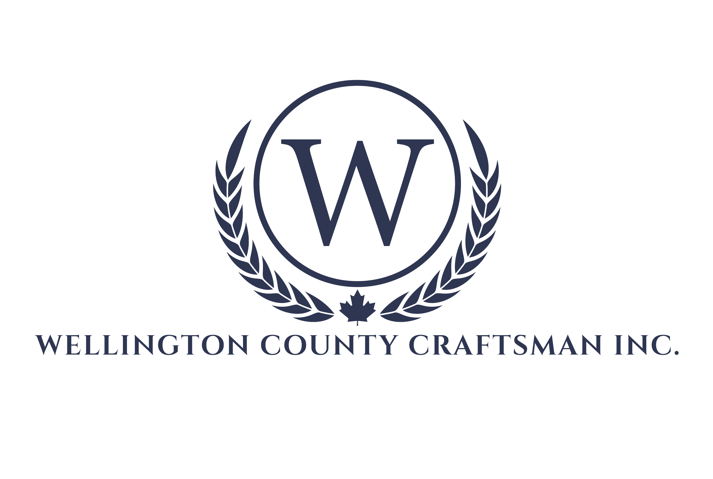 Logo for Wellington County Craftsman Inc. featuring a shield with a large 'W' at the center, surrounded by a laurel wreath and a maple leaf, with the company name below.