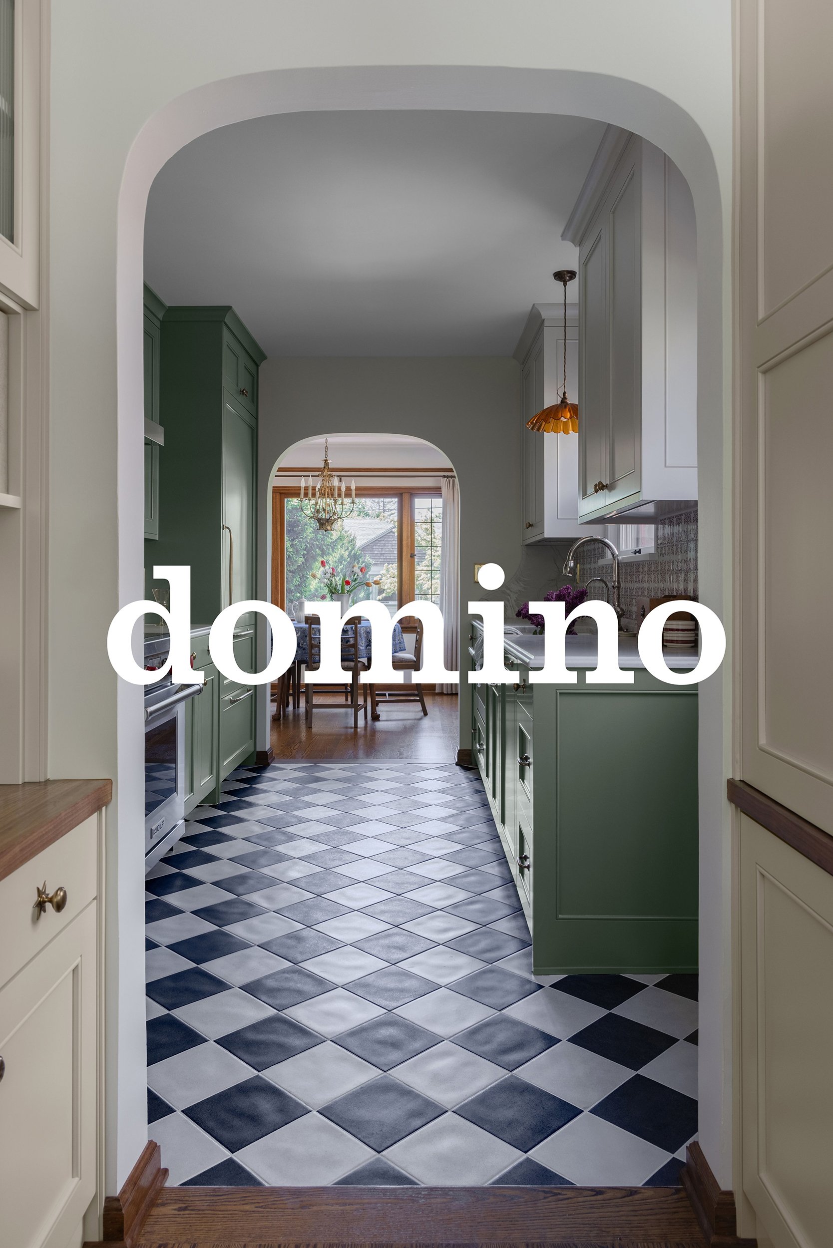 Domino press feature preview with a green galley kitchen, checkerboard floors, and brass details by Full Bloom Interior Design in Seattle.