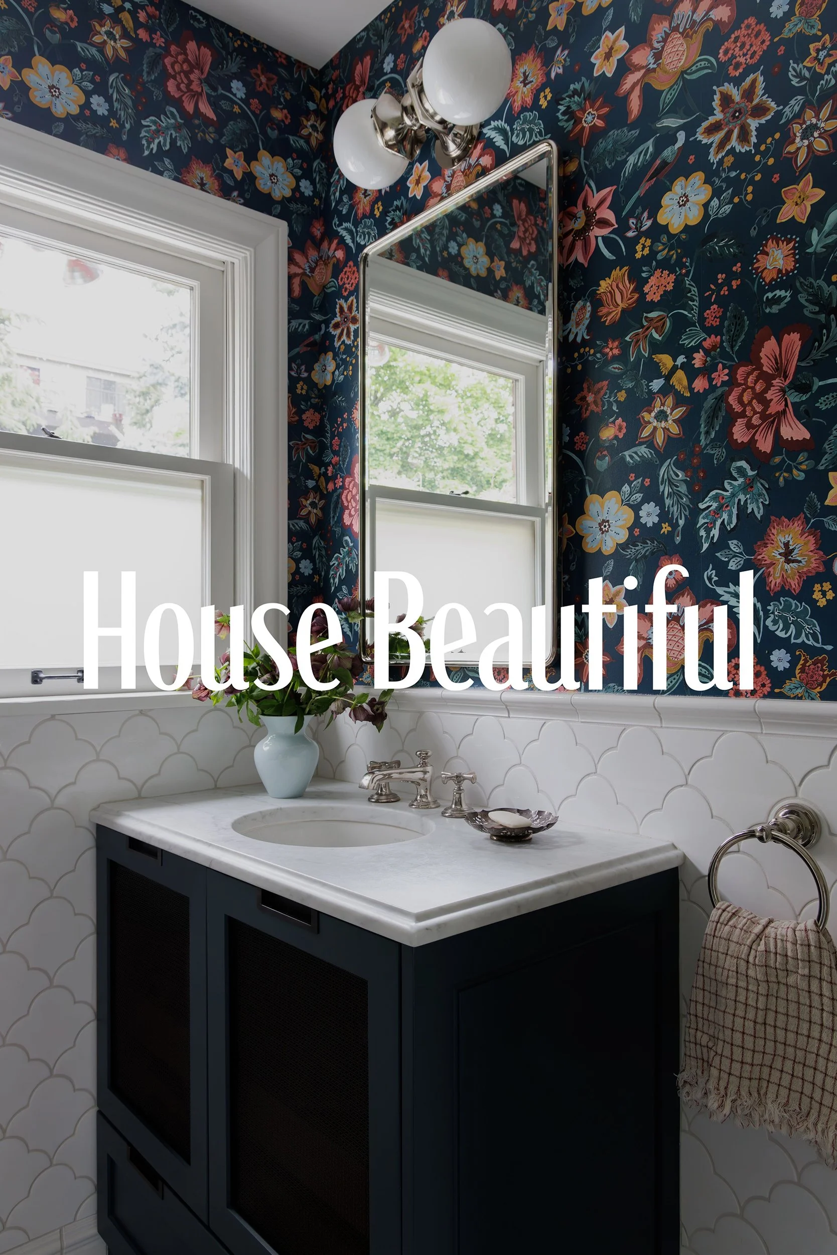 House Beautiful press feature preview with floral wallpaper, a navy vanity, and marble countertop by Full Bloom Interior Design in Seattle.