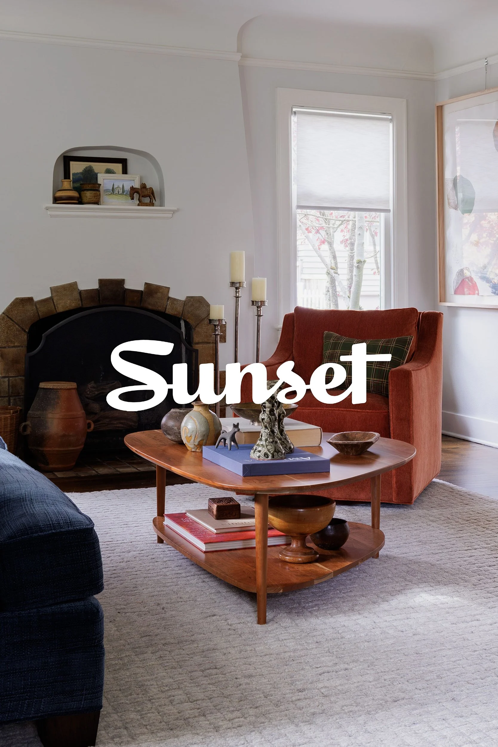 Sunset press feature preview with a living room, layered area rug, coffee table, and orange upholstered chair by Full Bloom Interior Design in Seattle.