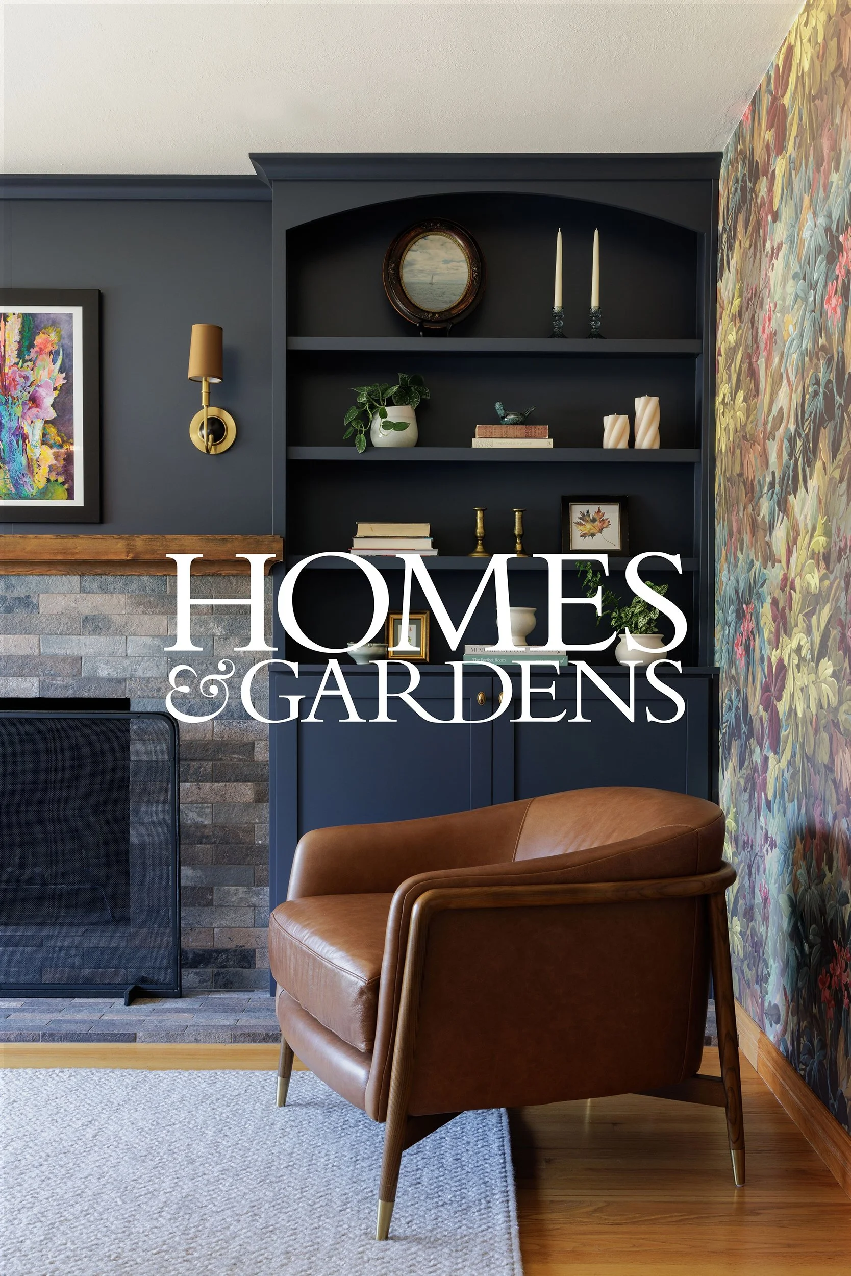 Homes & Gardens press feature preview with a leather chair and navy built-in cabinets beside a fireplace by Full Bloom Interior Design in Seattle.
