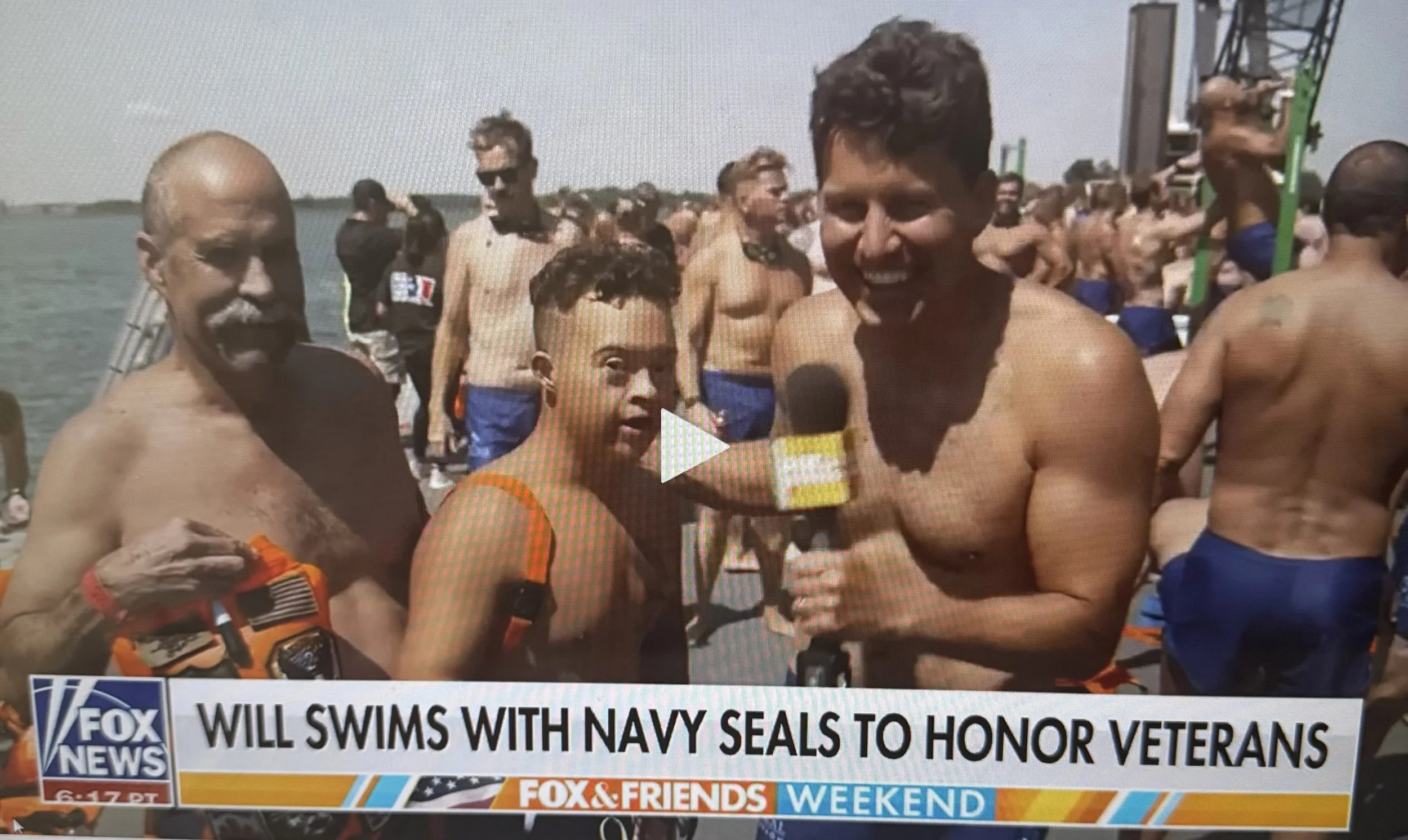 Robert Norris, Man of Iron, being interviewed by Fox News host Will Cain before the NYC Navy SEAL Foundation Swim.