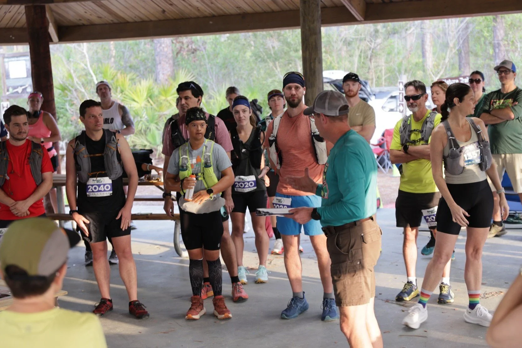 Robert Norris, Man of Iron, gathered with fellow runners during the pre-race briefing before the 50K trail ultramarathon.
