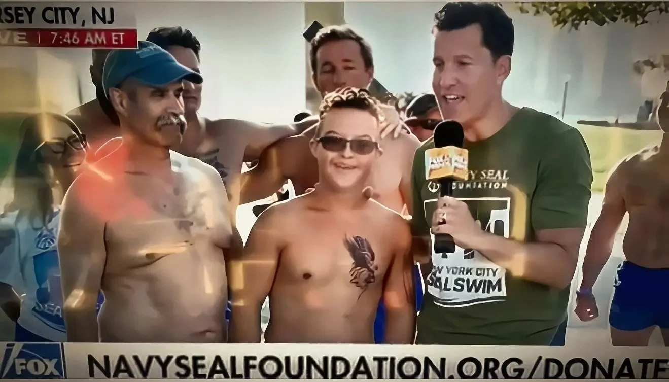 Robert Norris, Man of Iron, being interviewed by Fox News host Will Cain at the NYC Navy SEAL Foundation Swim
