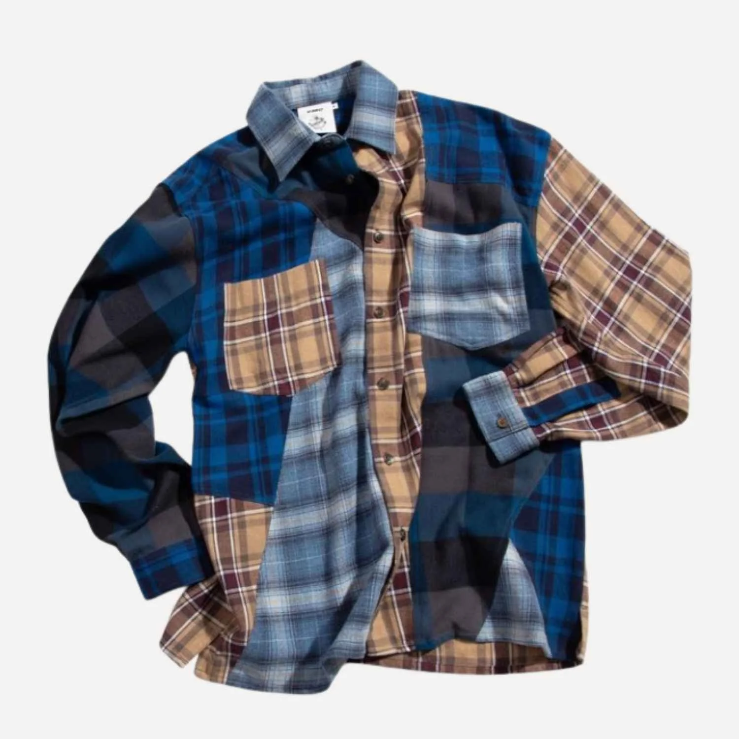 A long-sleeve button-up shirt manufactured by Beyond Remade for global fashion brand YMC.