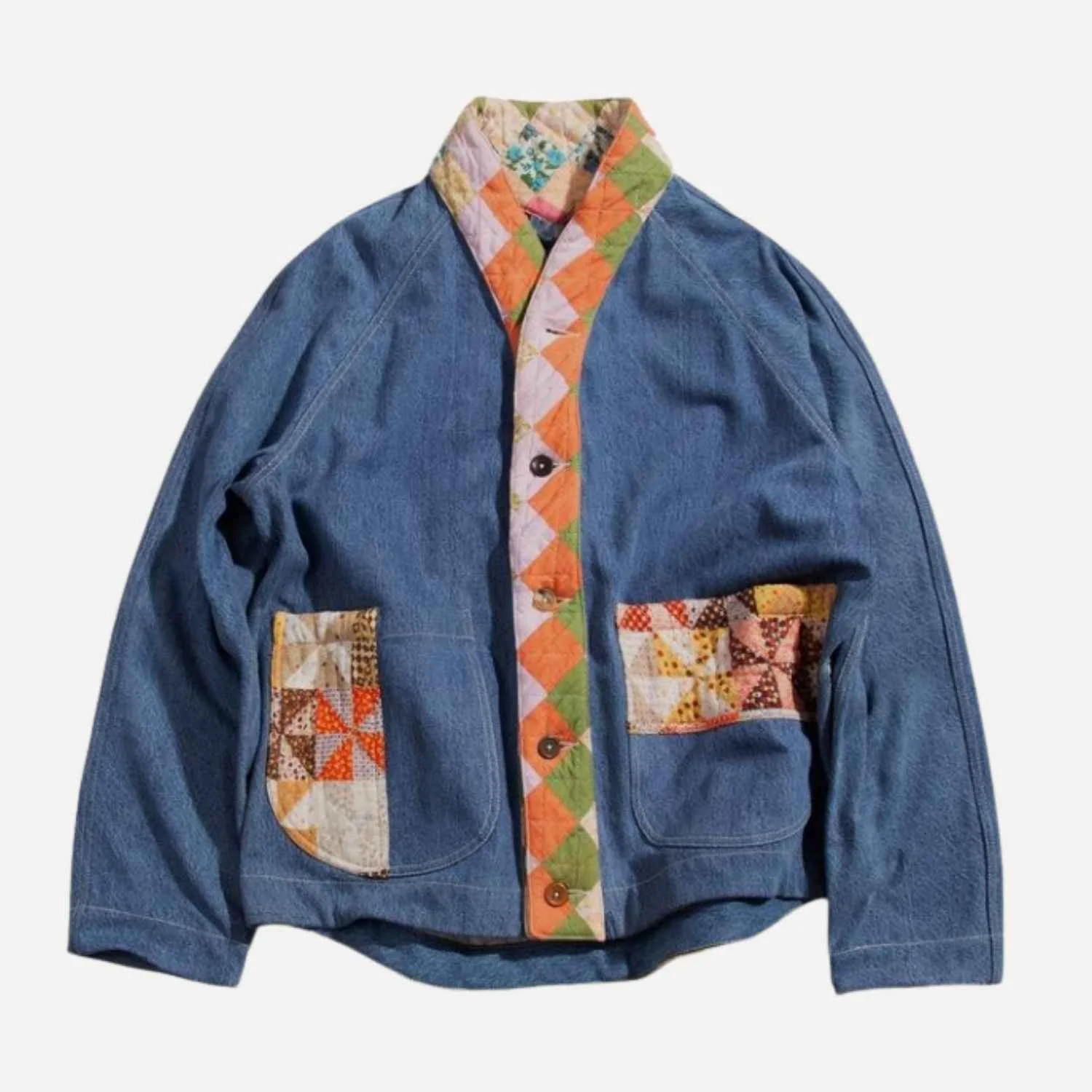 Upcycled denim jacket with colorful quilted patch pockets and a decorative quilted trim along the front opening and collar manufactured by Beyond Remade for YMC fashion brand.
