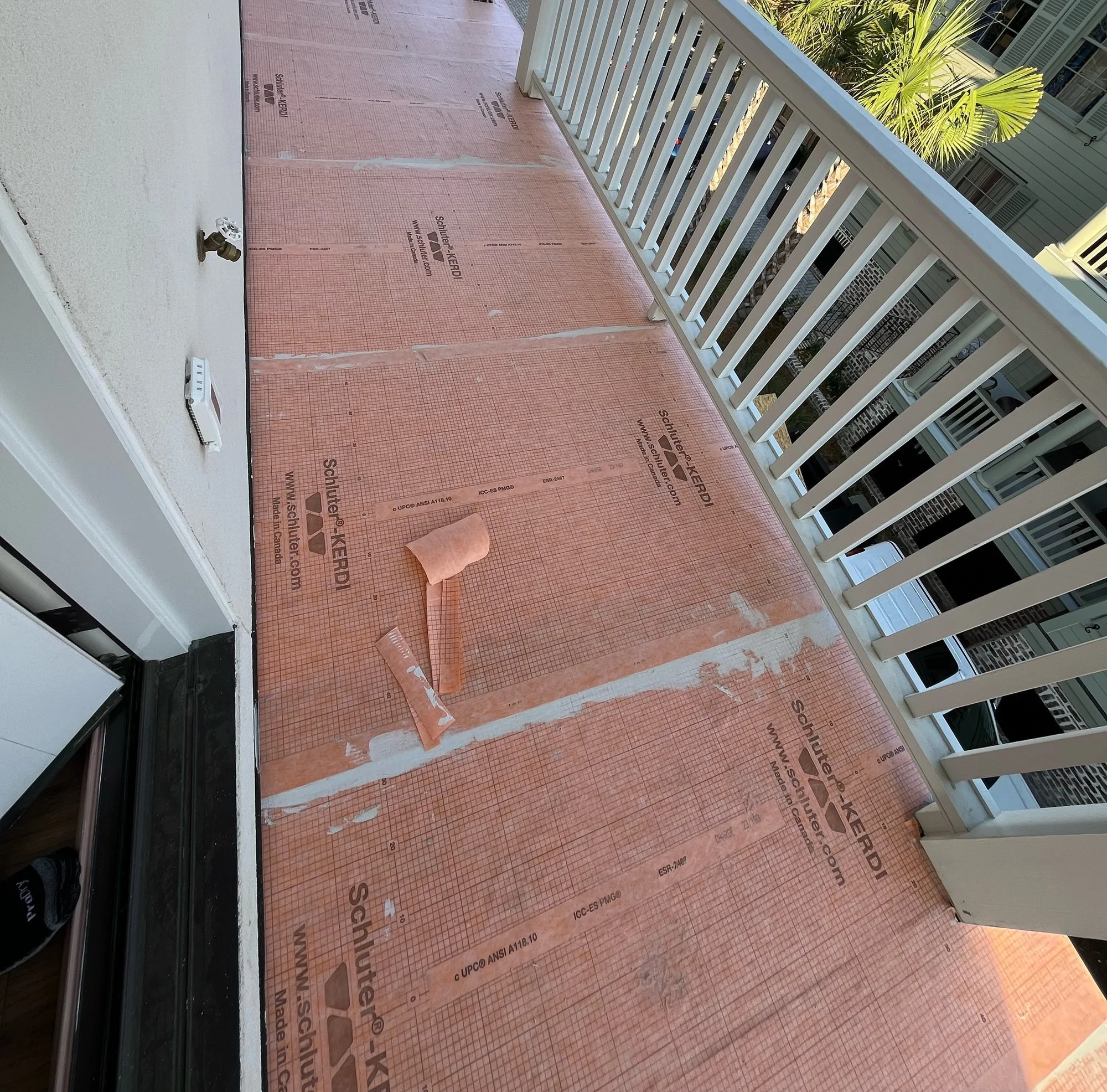 Balcony deck with waterproofing membrane installed before tile