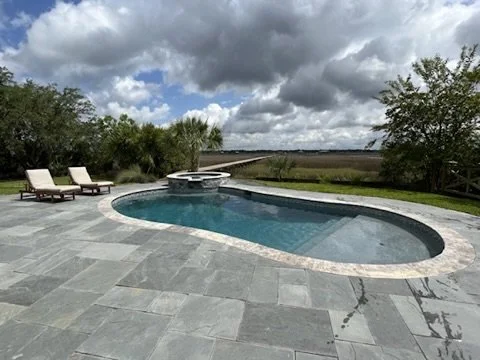09-finished-pool-and-paver-patio-view.jpeg