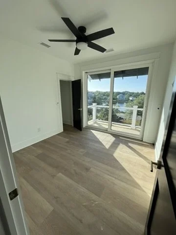 11-finished-looking-finished-interior-room-with-balcony.jpeg