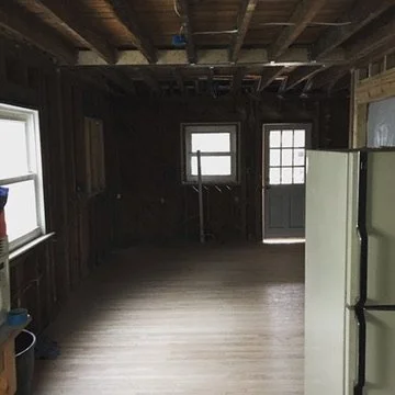 01-before-kitchen-remodel-exposed-framing-and-old-refrigerator.jpeg