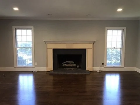 03-finished-living-room-fireplace-and-windows.jpeg