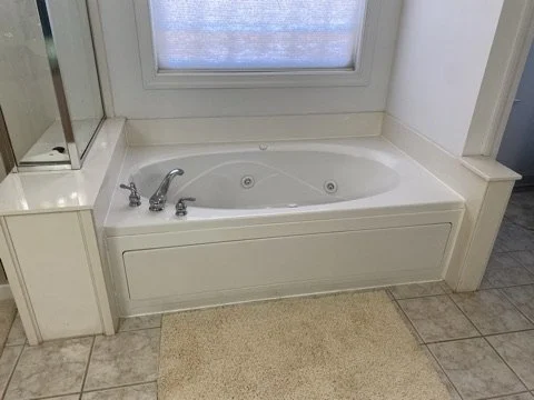 02-existing-whirlpool-tub-and-shower.jpeg