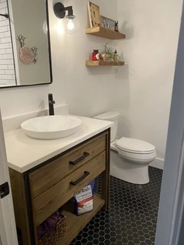 01-finished-bathroom-vanity-toilet-and-hex-floor.jpeg