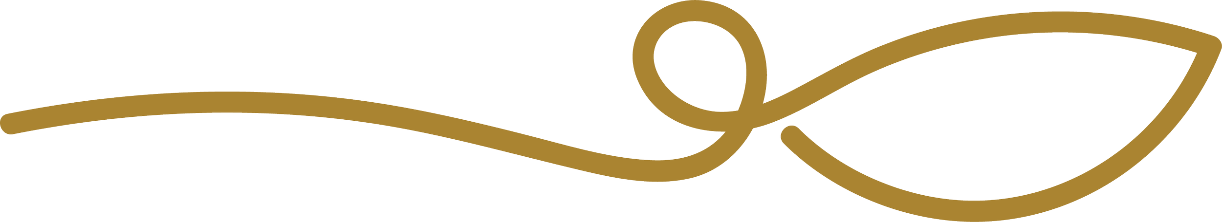 Close-up of a gold-colored decorative floral element with a curving stem and a large leaf.
