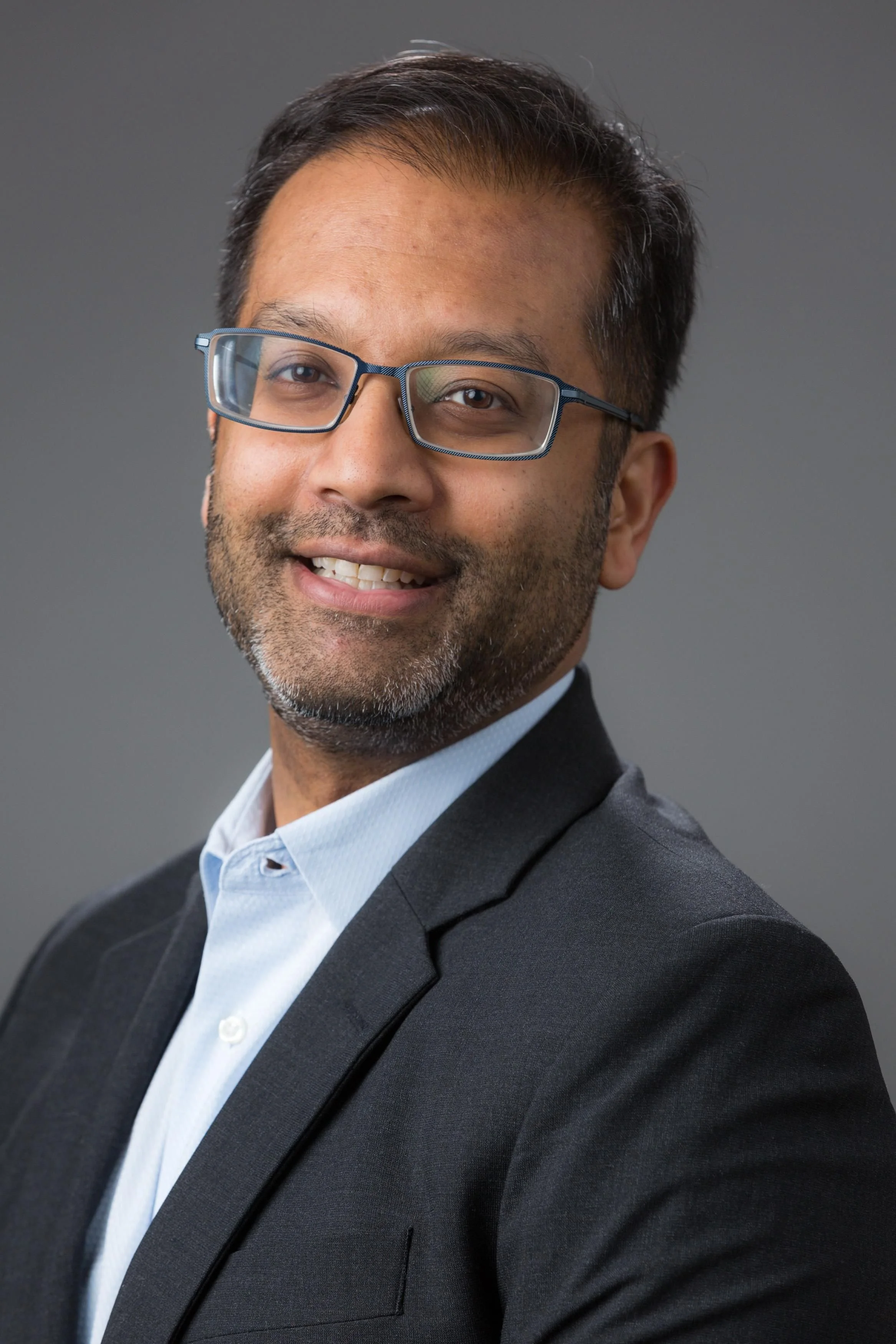 Headshot of man smiling at camera