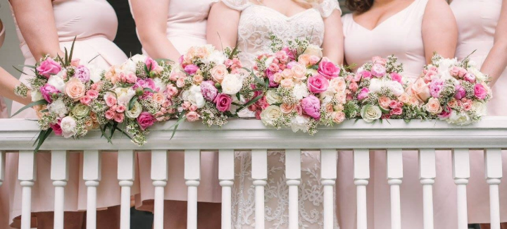 Bridal party flowers, a bride and bridesmaids with their bouquets. bridal bouquet, bridesmaids bouquets.
