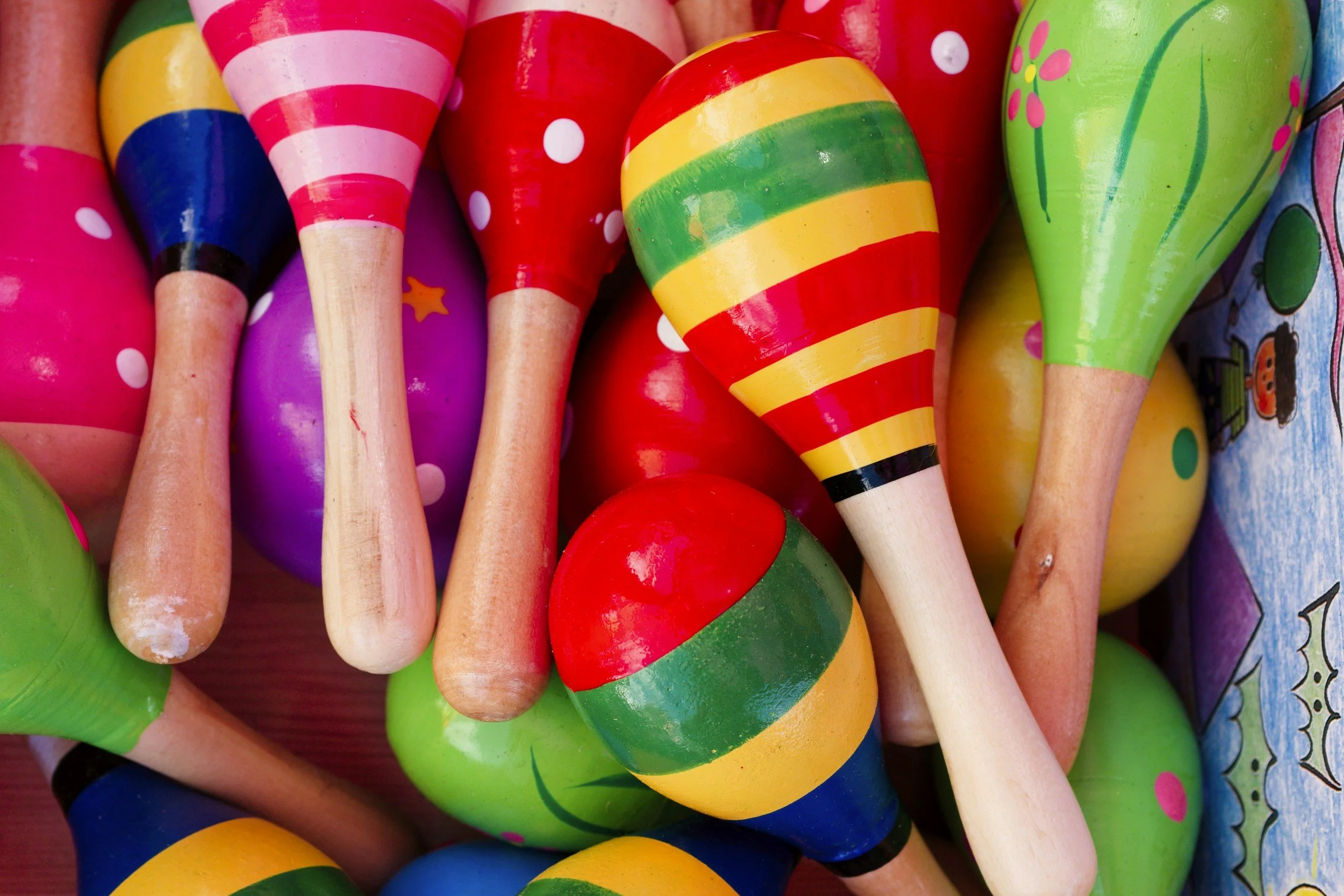 Colorful wooden maracas with striped and dotted patterns