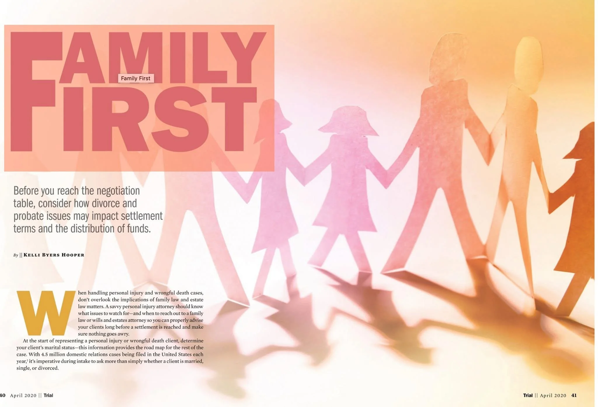 Silhouette paper cutout of a family holding hands, with a warm sunset background, accompanied by large text reading 'FAMILY FIRST'