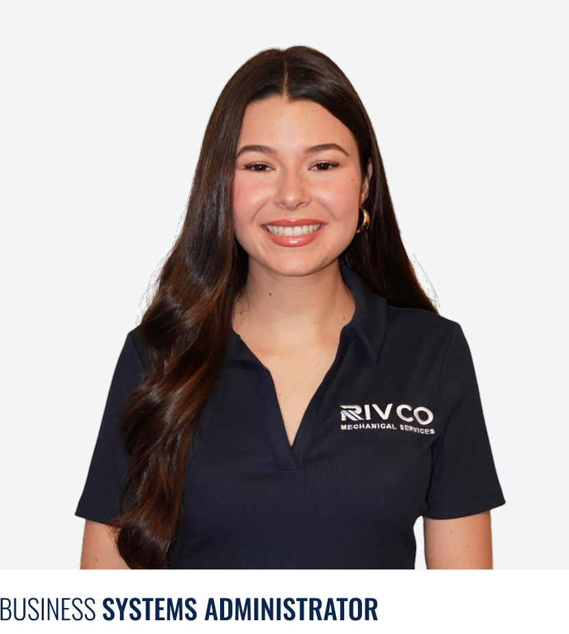 A young woman with long brown hair, wearing a navy blue polo shirt with 'RIVCO Mechanical Services' logo, smiling against a plain white background.