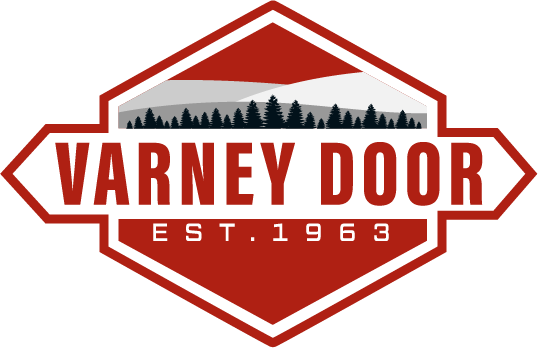 Logo for Varney Door, established in 1963, featuring a mountain landscape with trees in the background.