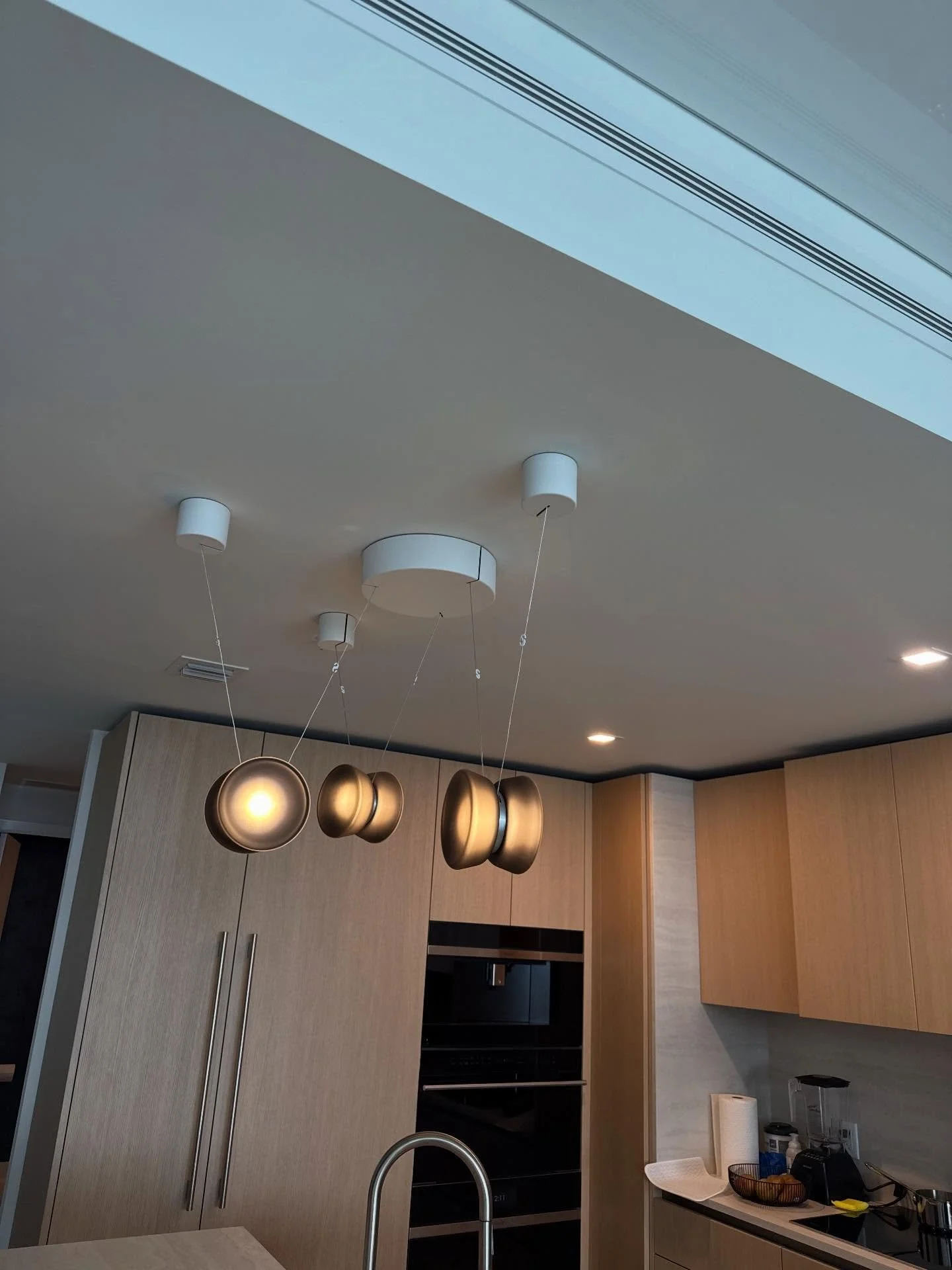 Precision install on this low-voltage designer fixture. Clean mounting, concealed wiring, and flawless alignment to elevate the entire kitchen. Details matter.