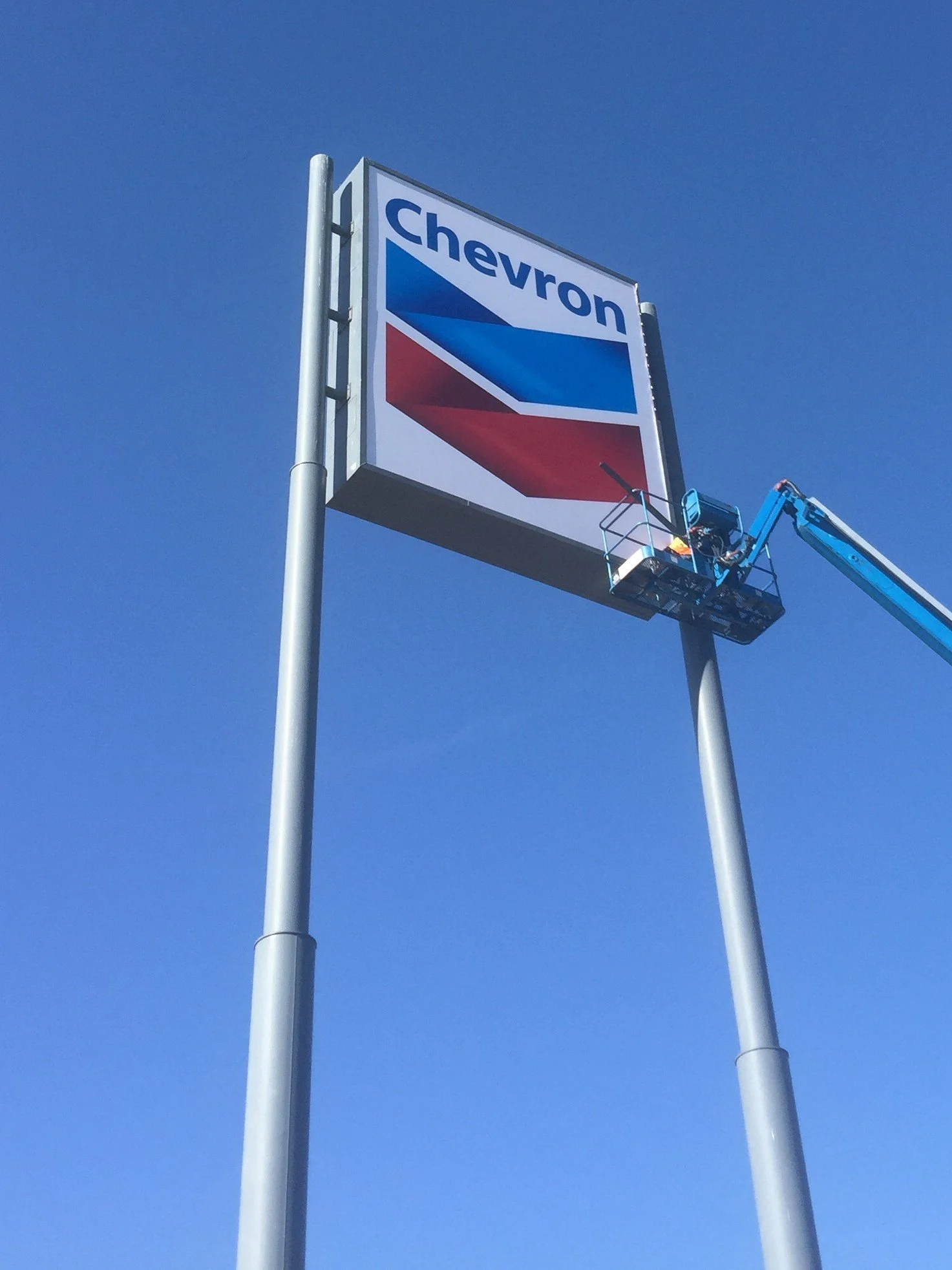 Chevron High Rise Sign