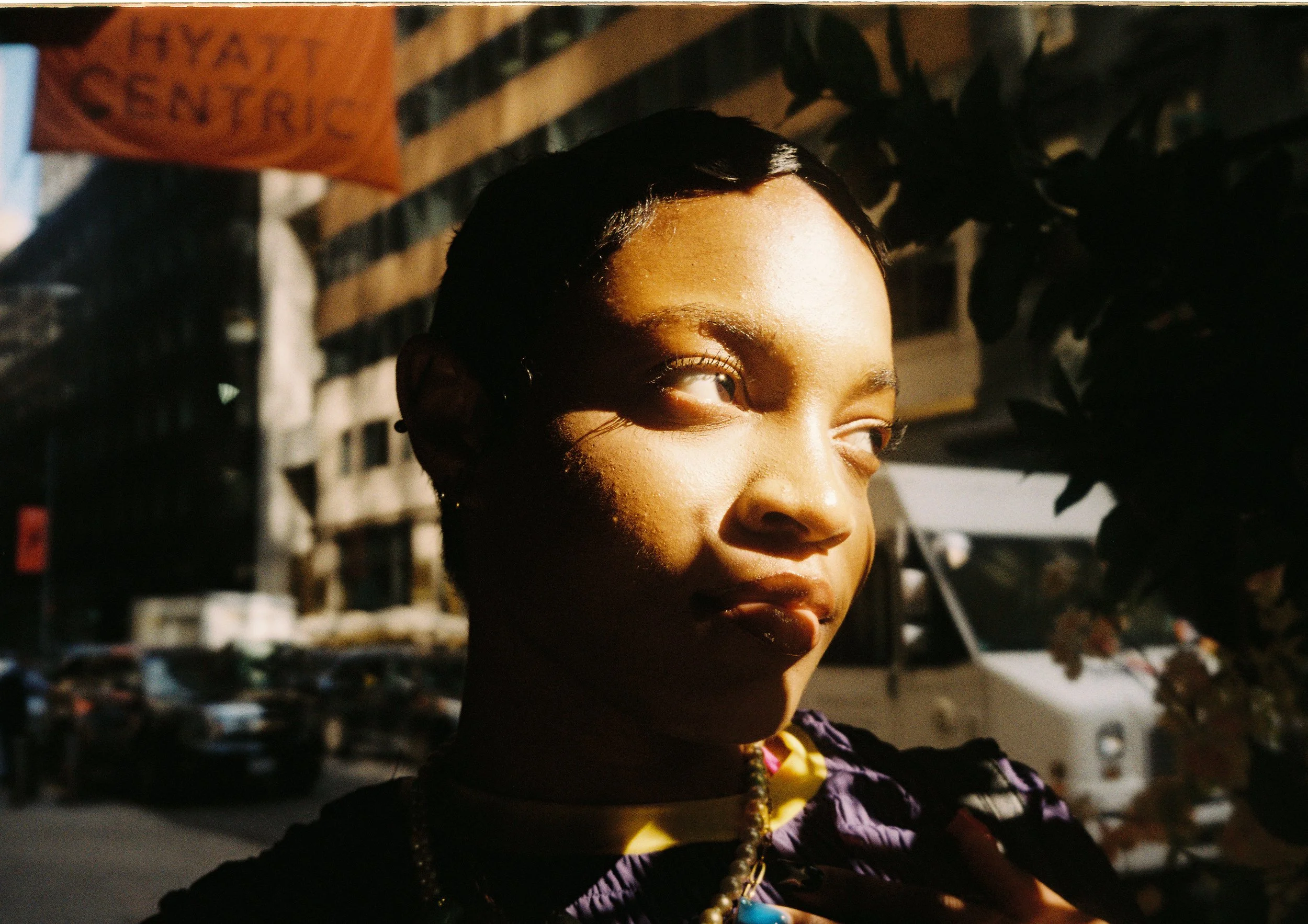 Close-up framing of Noelle on street