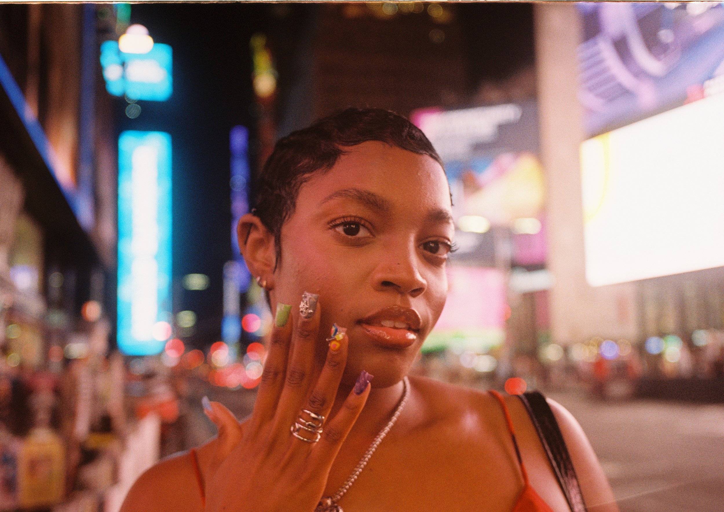 Close-up framing of Noelle on street