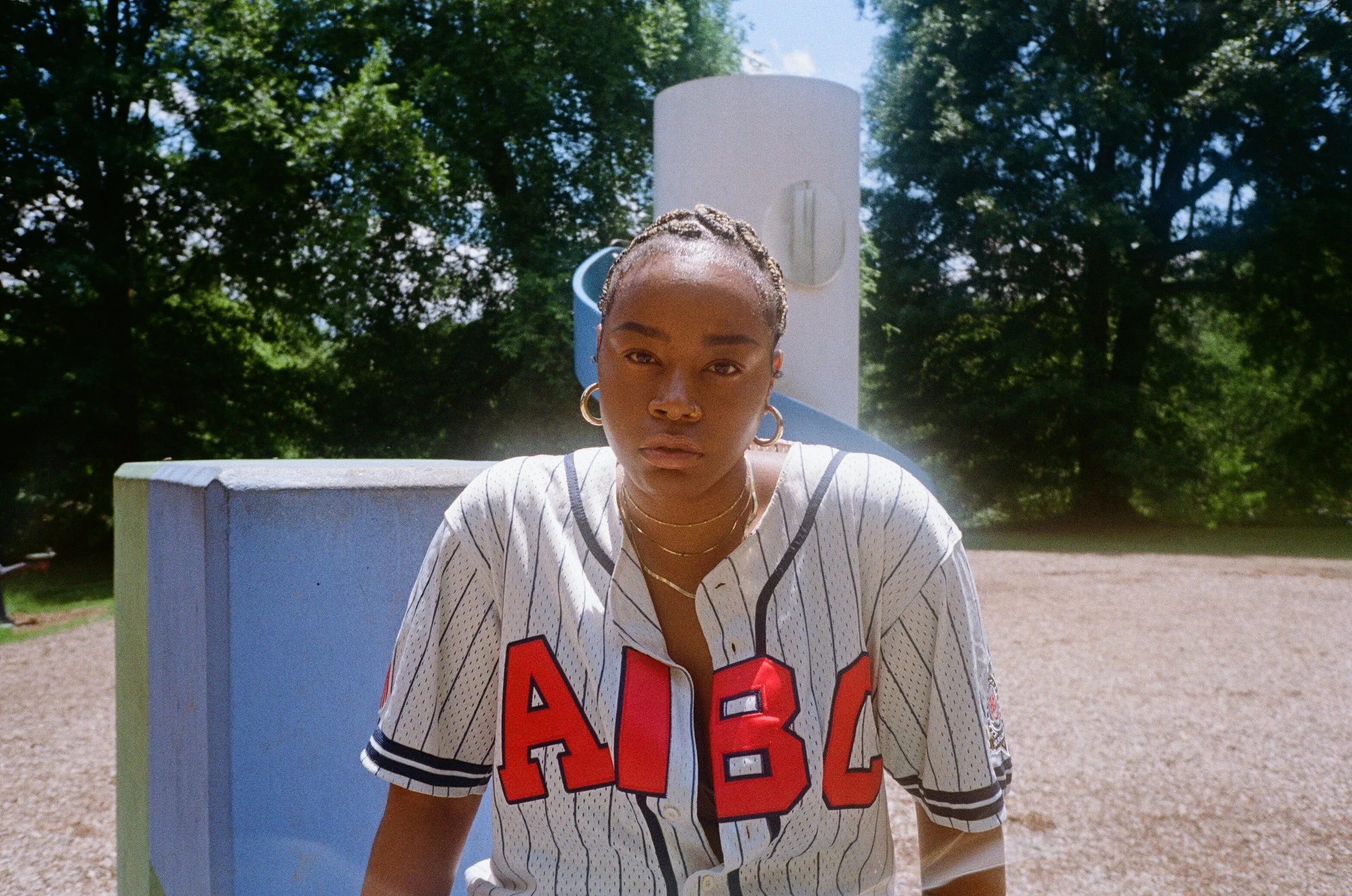 Half-body framing of Taylor in playground