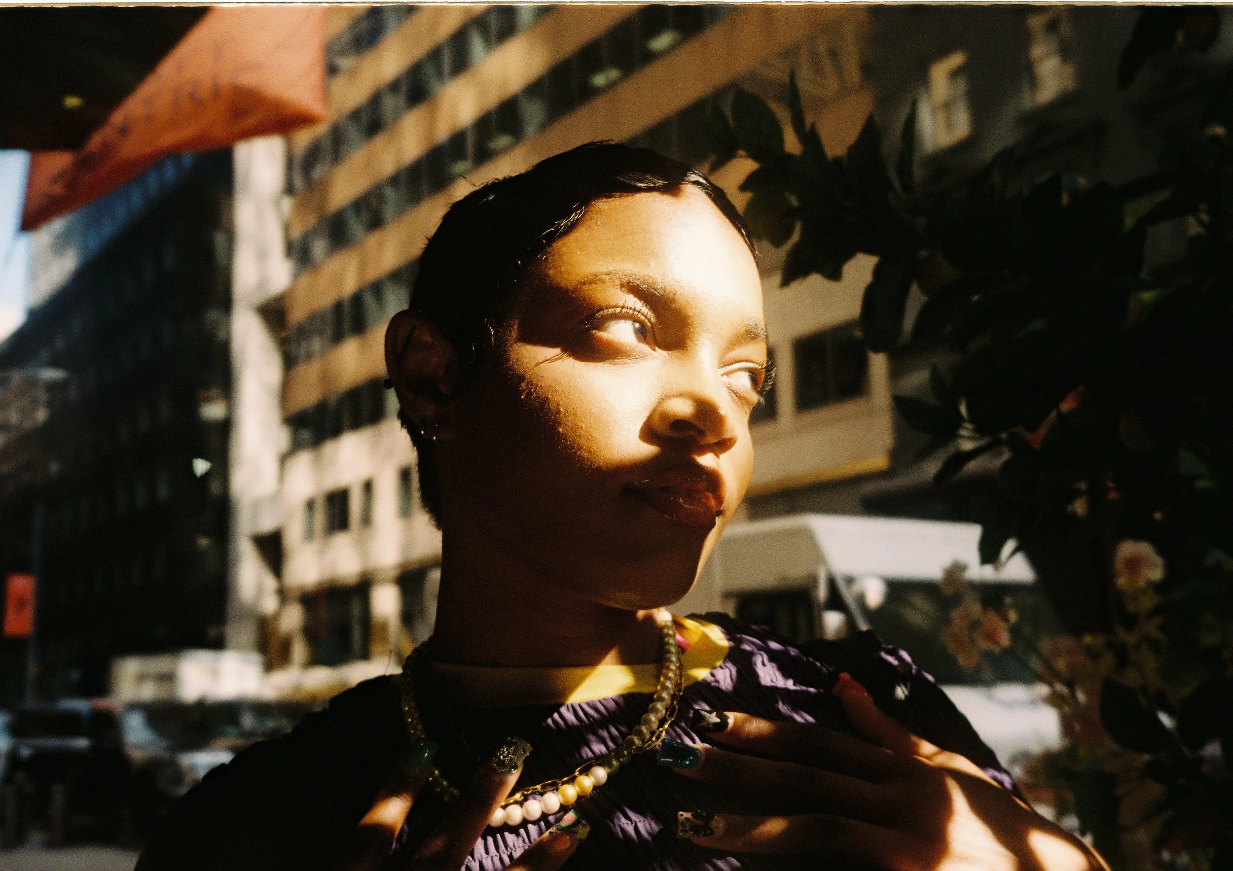 Close-up framing of Noelle on street
