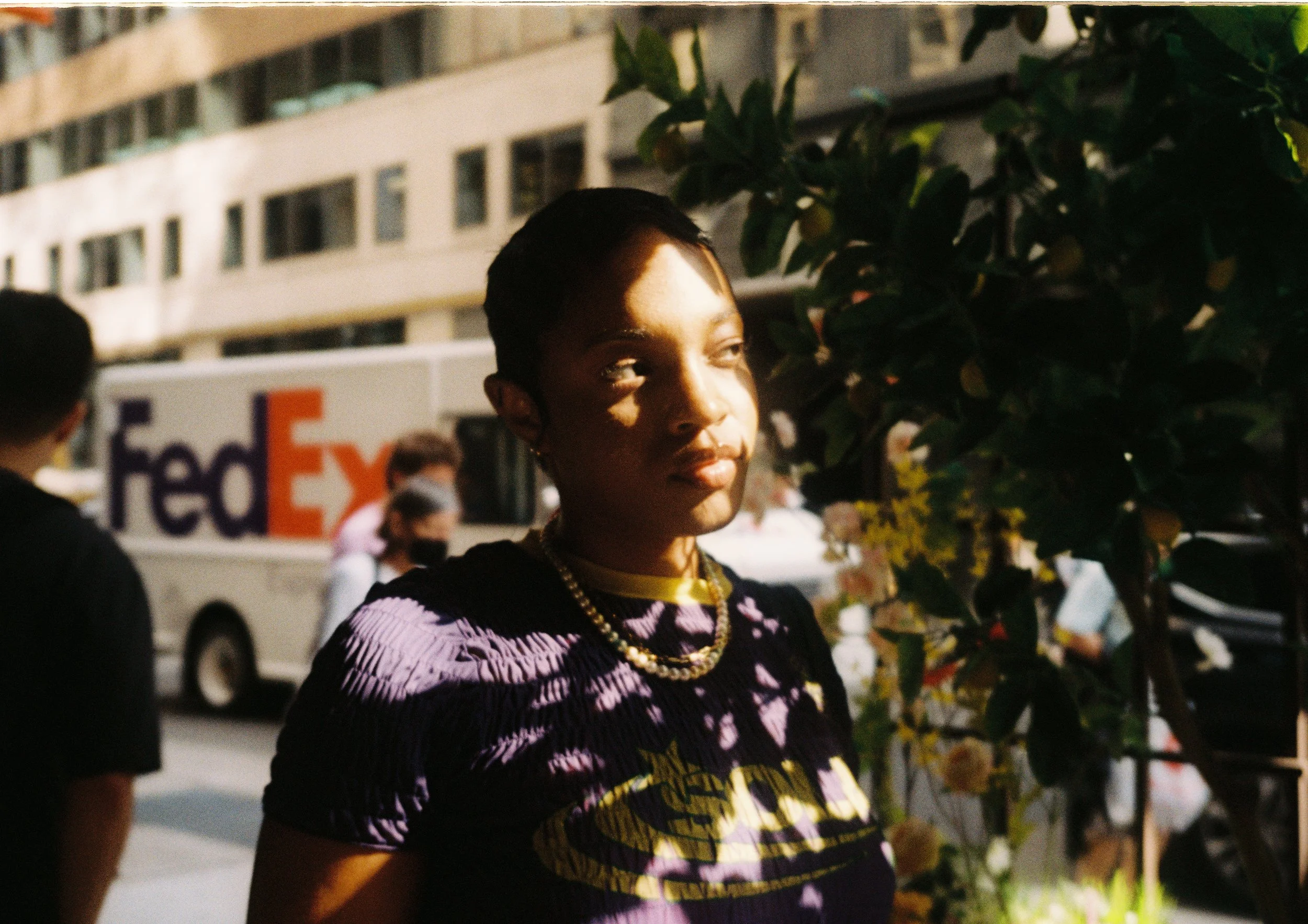 Half-body framing of Noelle on street