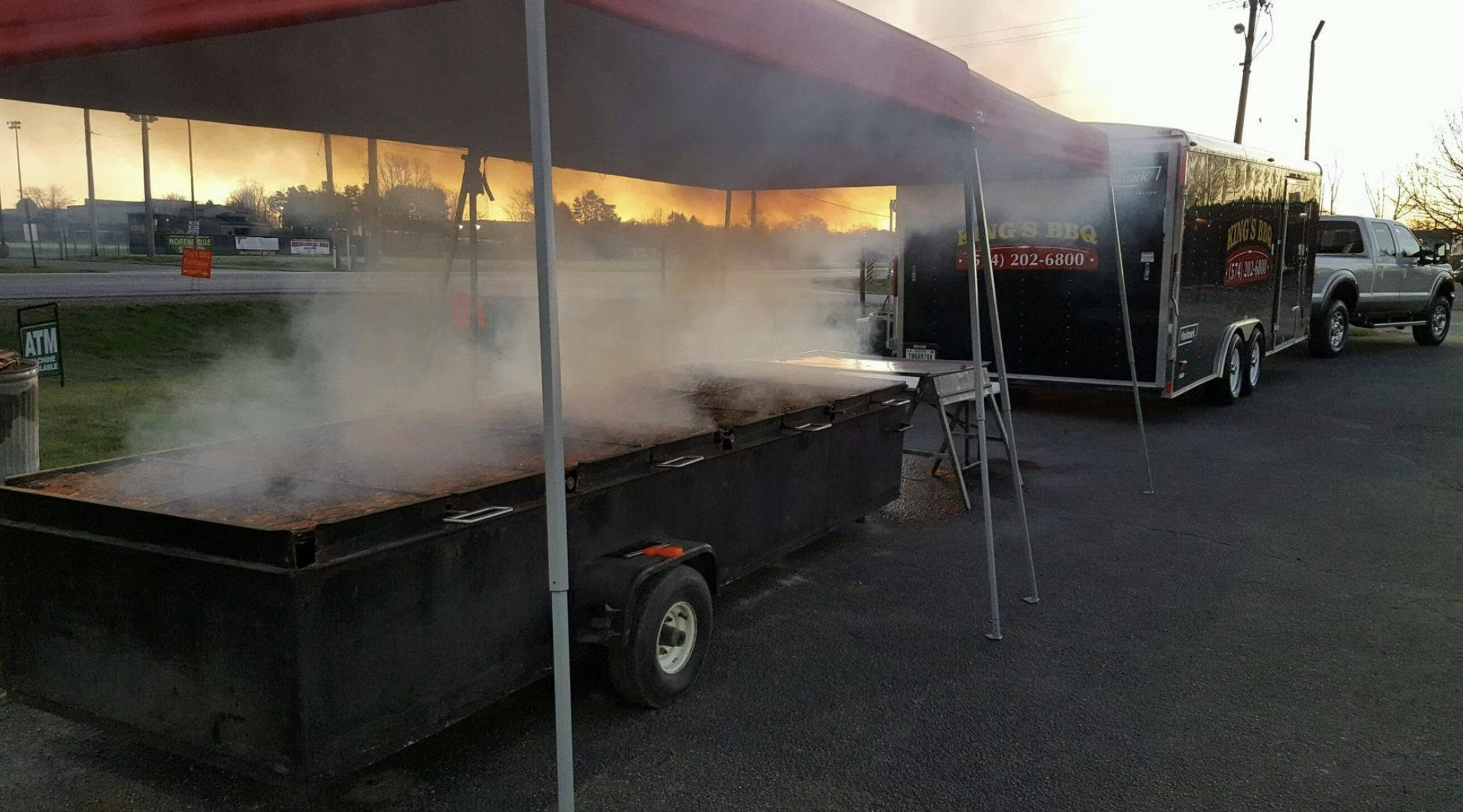 A Kings BBQ food truck with a barbecue smoker preparing for event in Northern, Indiana.