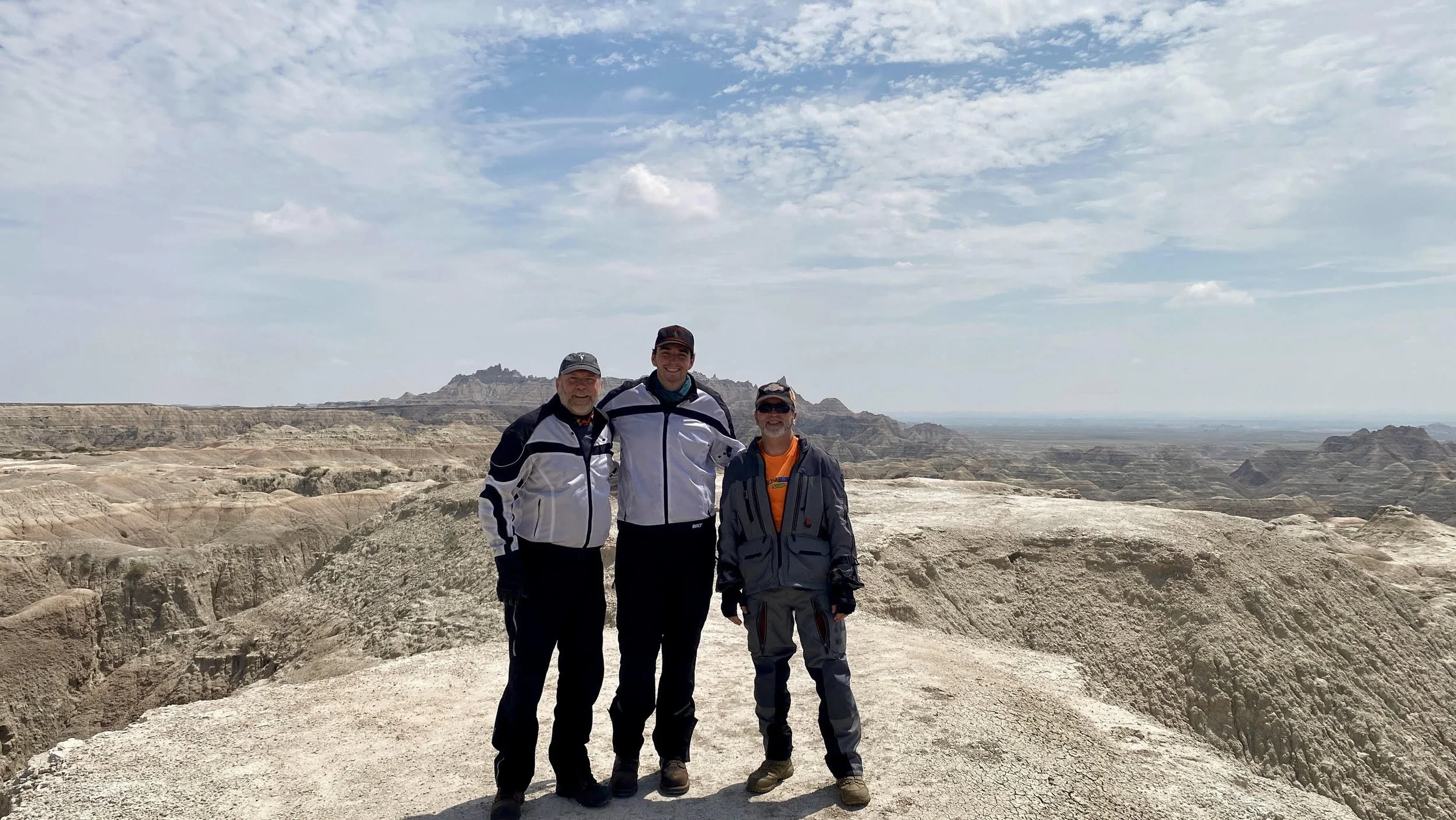 Nathan Brownell stands alongside Father and Godfather in Badlands National Park