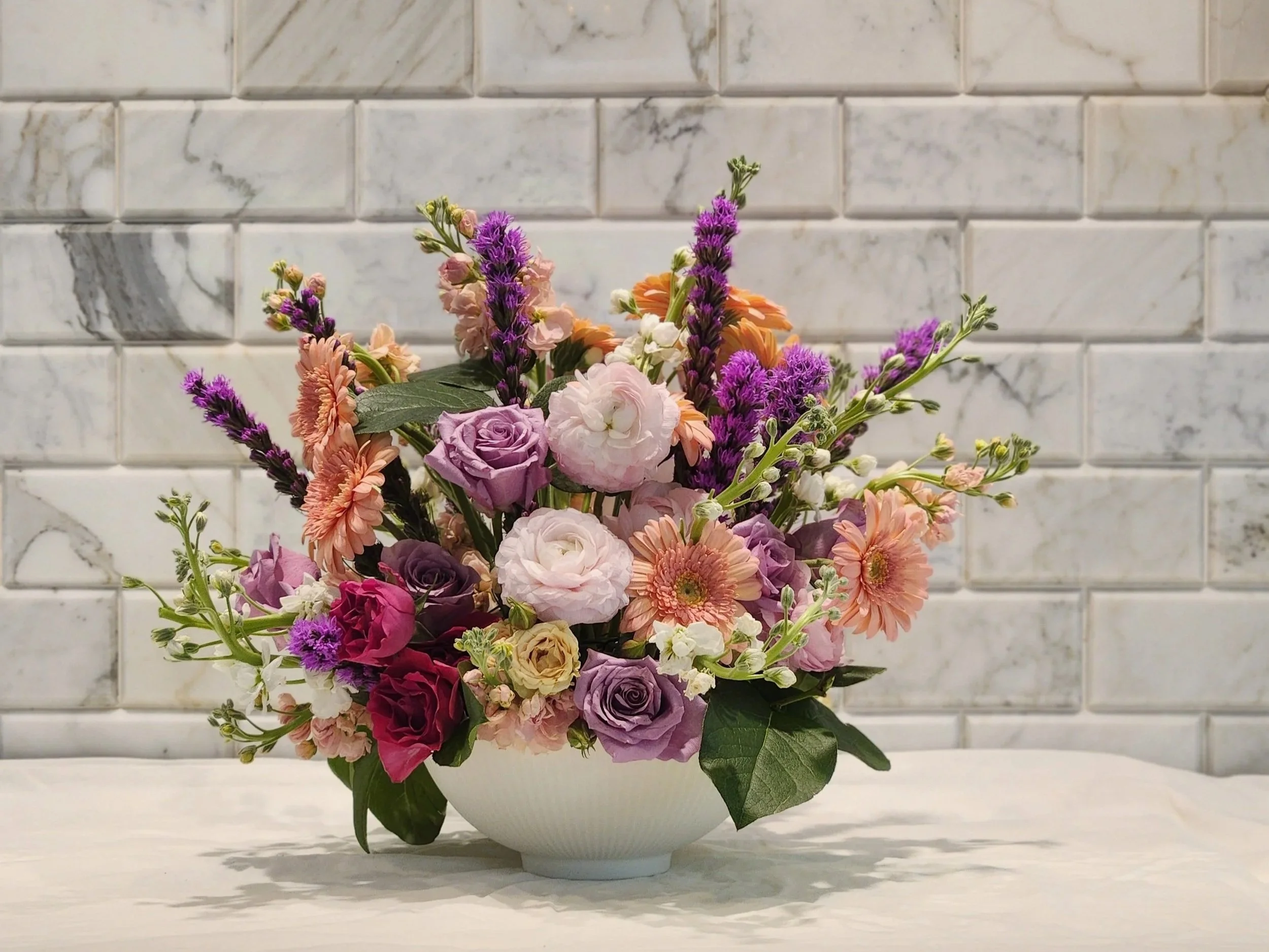 Formal wedding reception floral arrangement, sherbet pastels