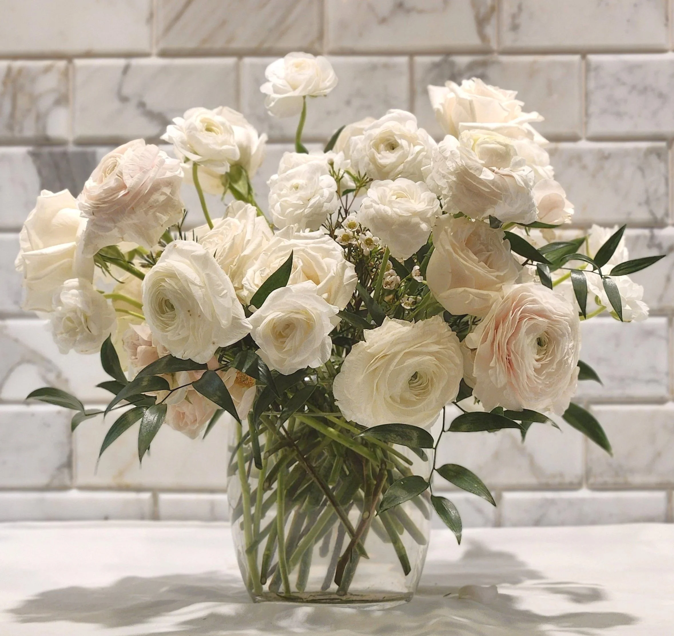 Romantic wedding centerpiece, white ranunculus and roses