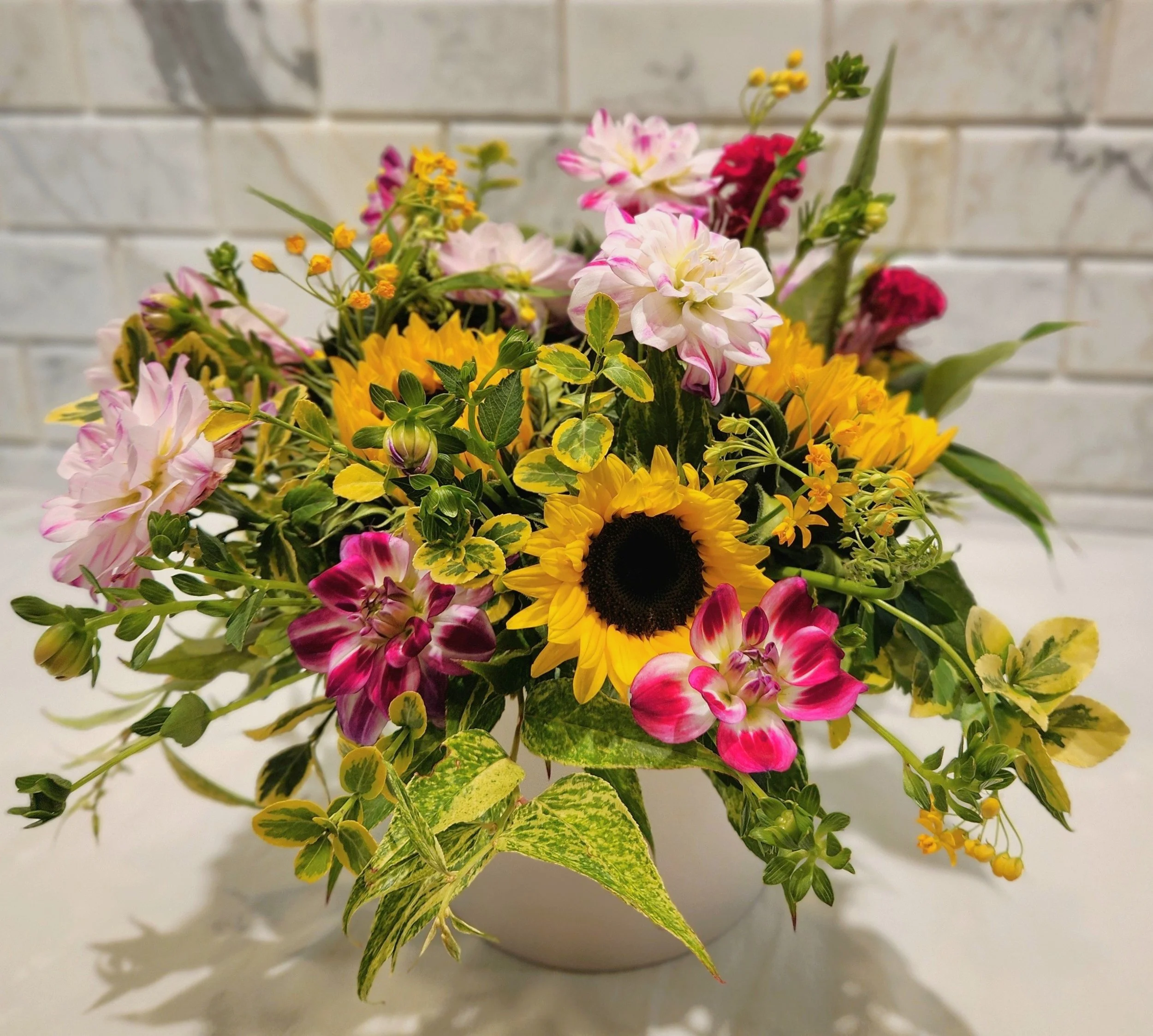 Summer wedding bouquet, sunflowers and pink dahlias