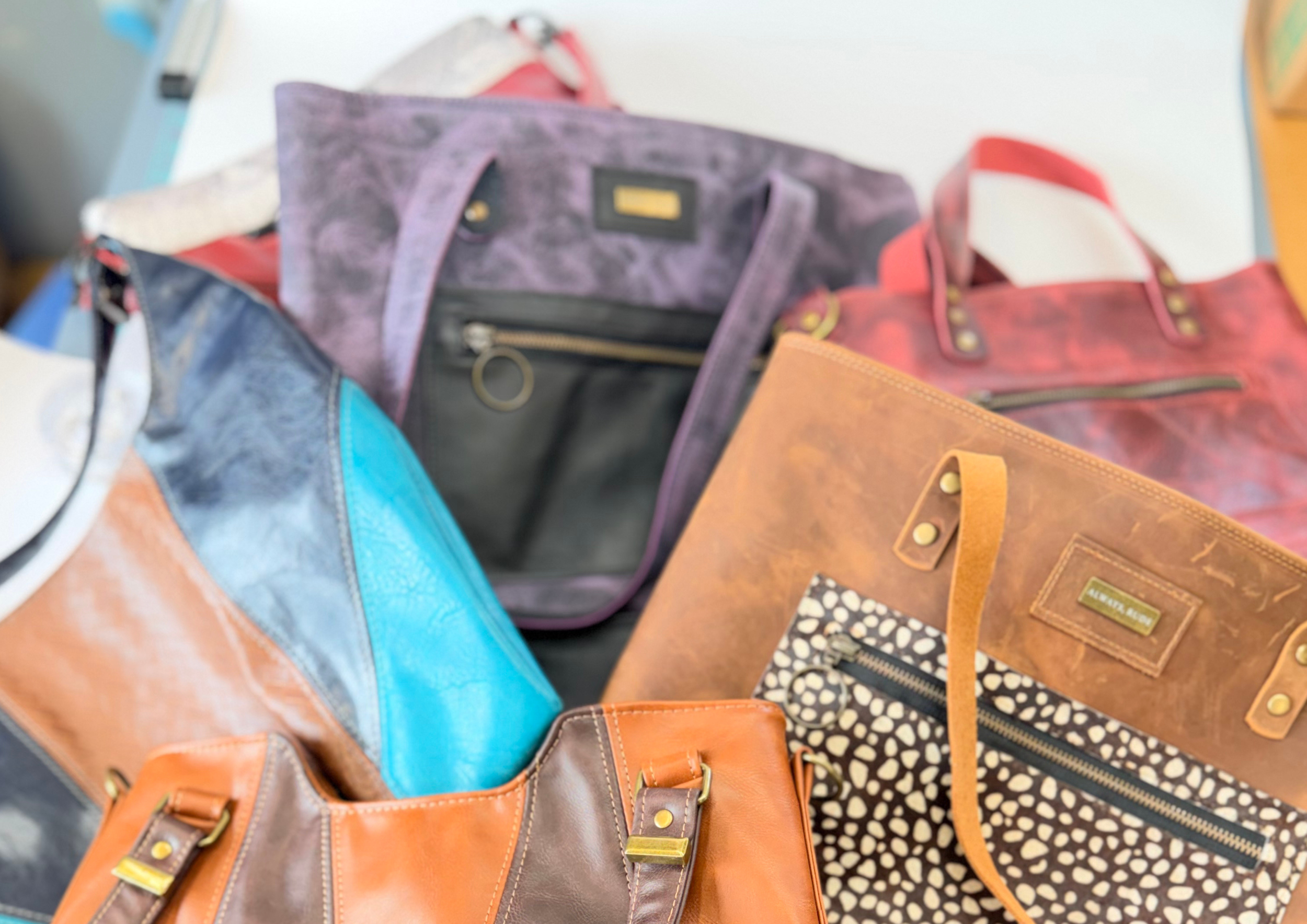 An arial picture of multiple bags from the chaos collection laid next to eachother