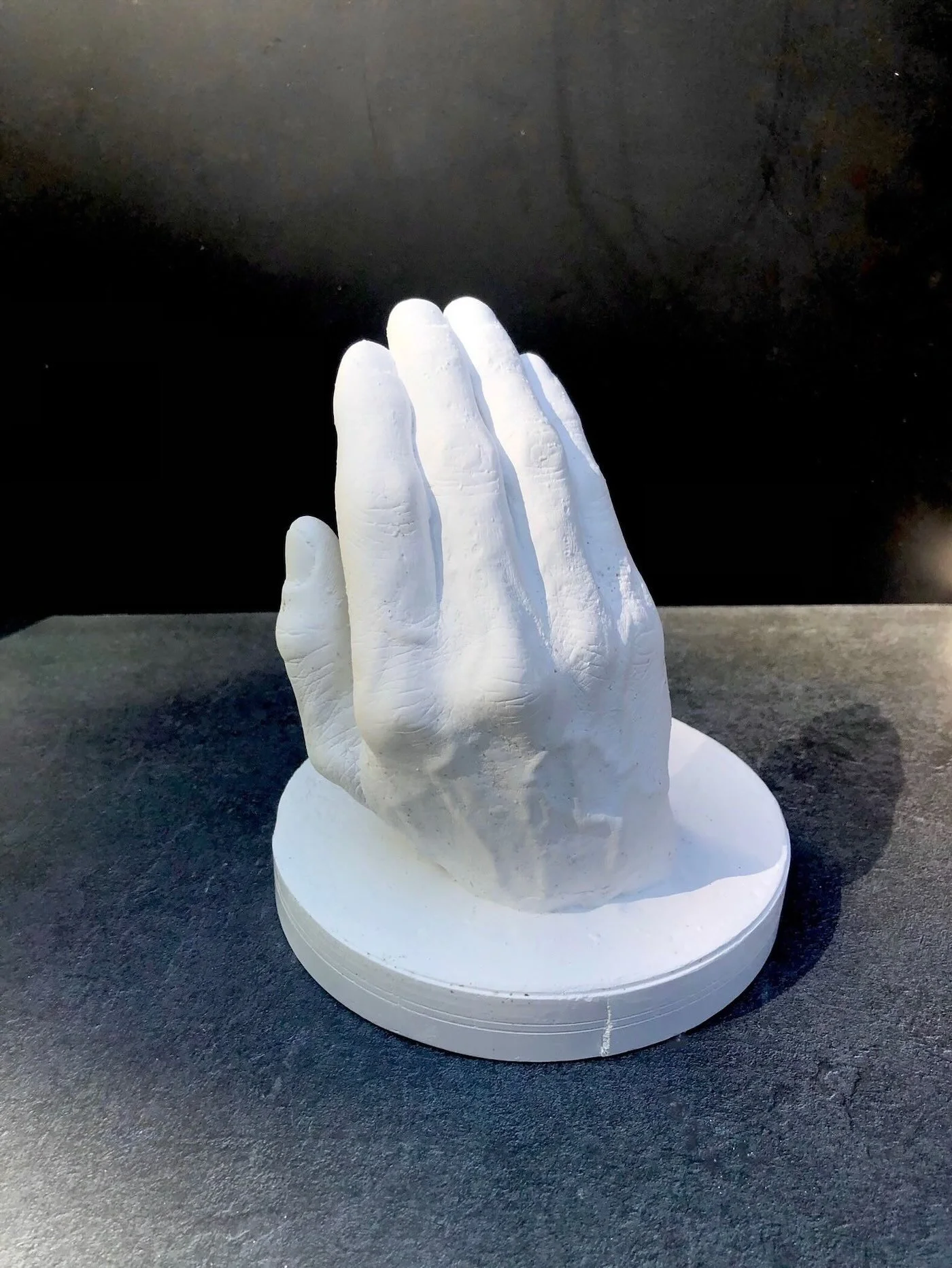"Daughter" - plaster sculpture of builders hand as he described raising his daughter. 8"h x 6"w by Shawndel N. Fraser