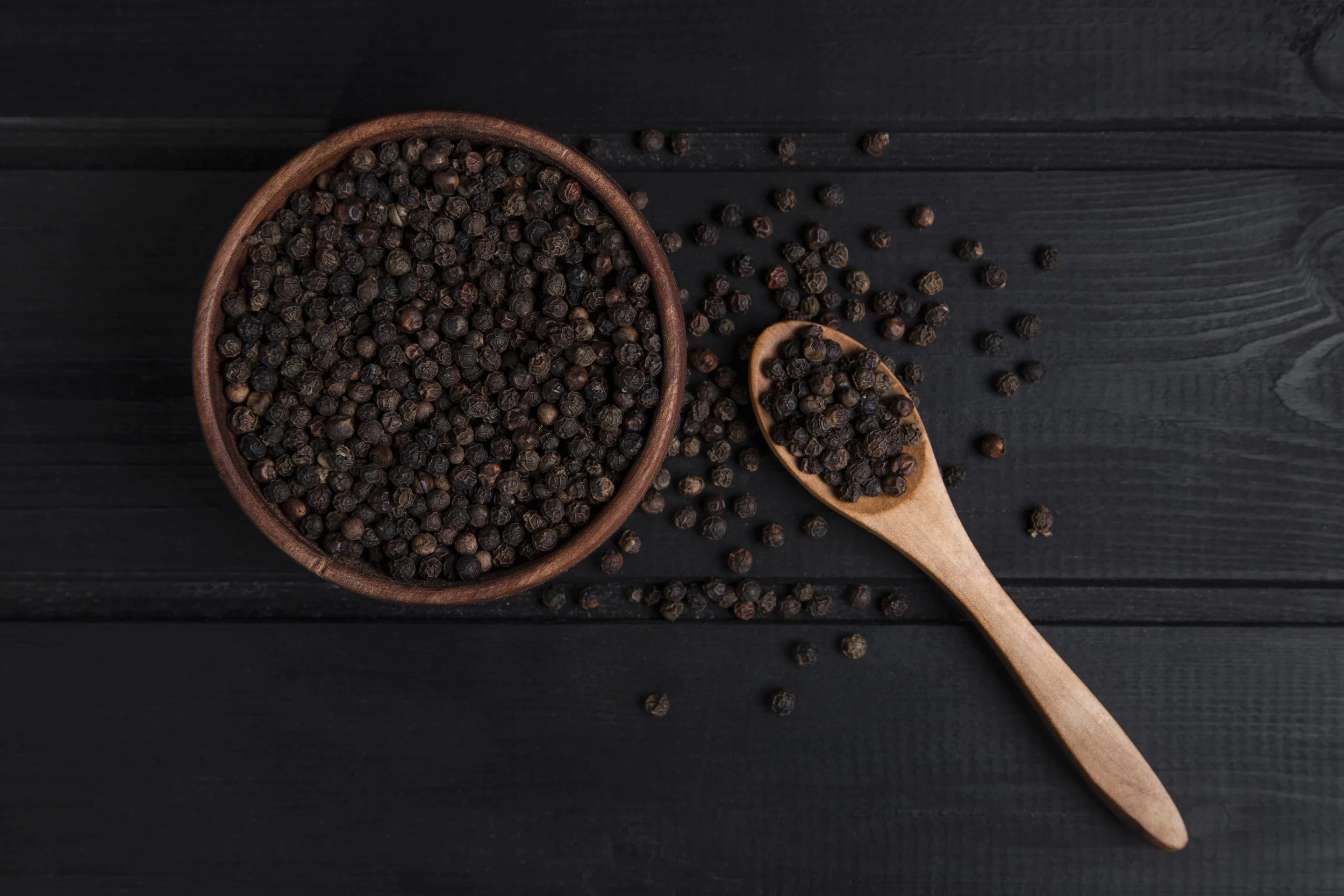 wooden-spoon-full-pepper-corns-placed-dark-wooden-table-high-quality-photo.jpg