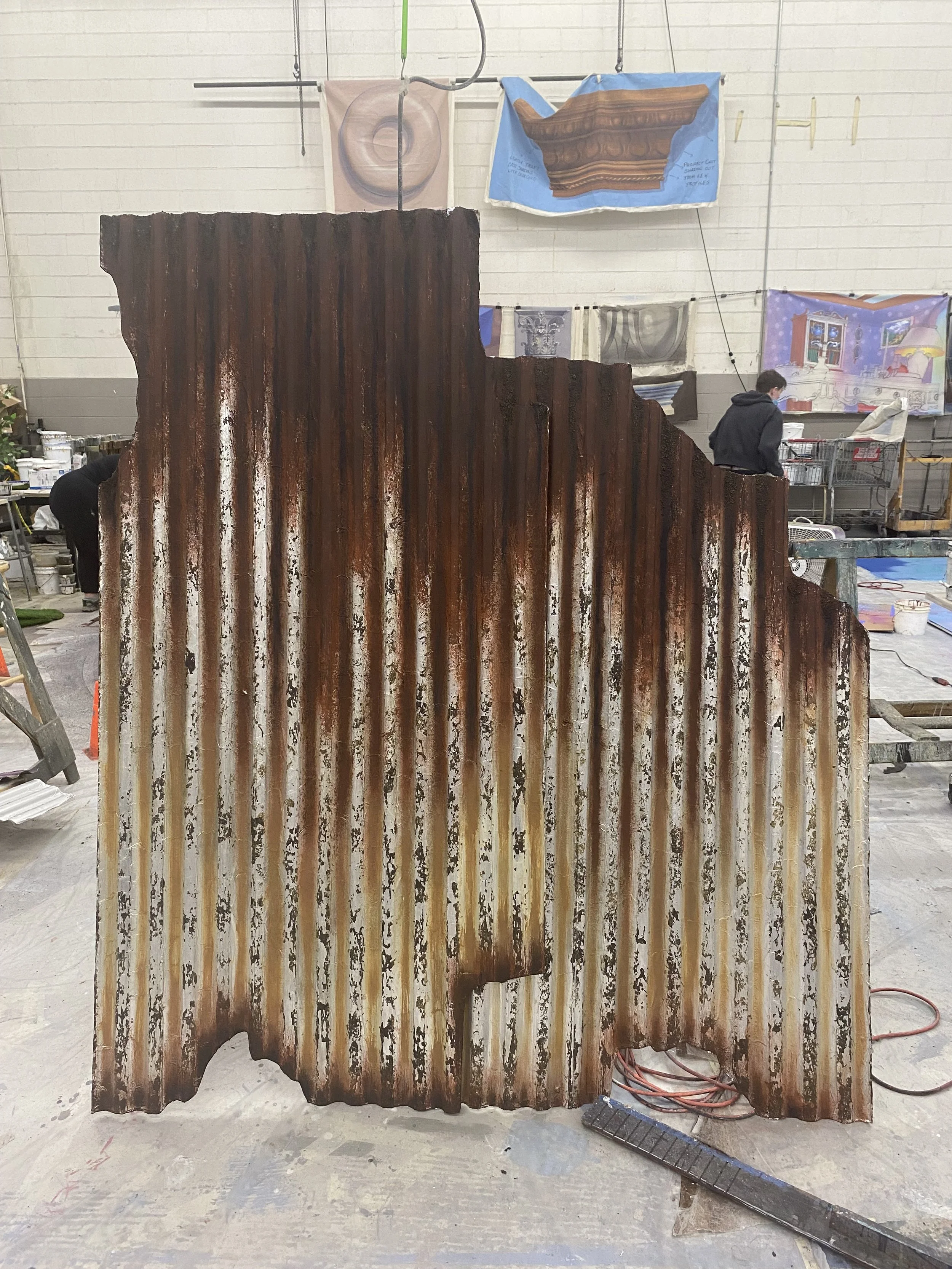 Rust texture on corrugated plastic covered in tin foil