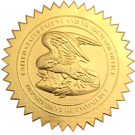 Close-up of a gold medal with an eagle in the center and an inscription around the edge.