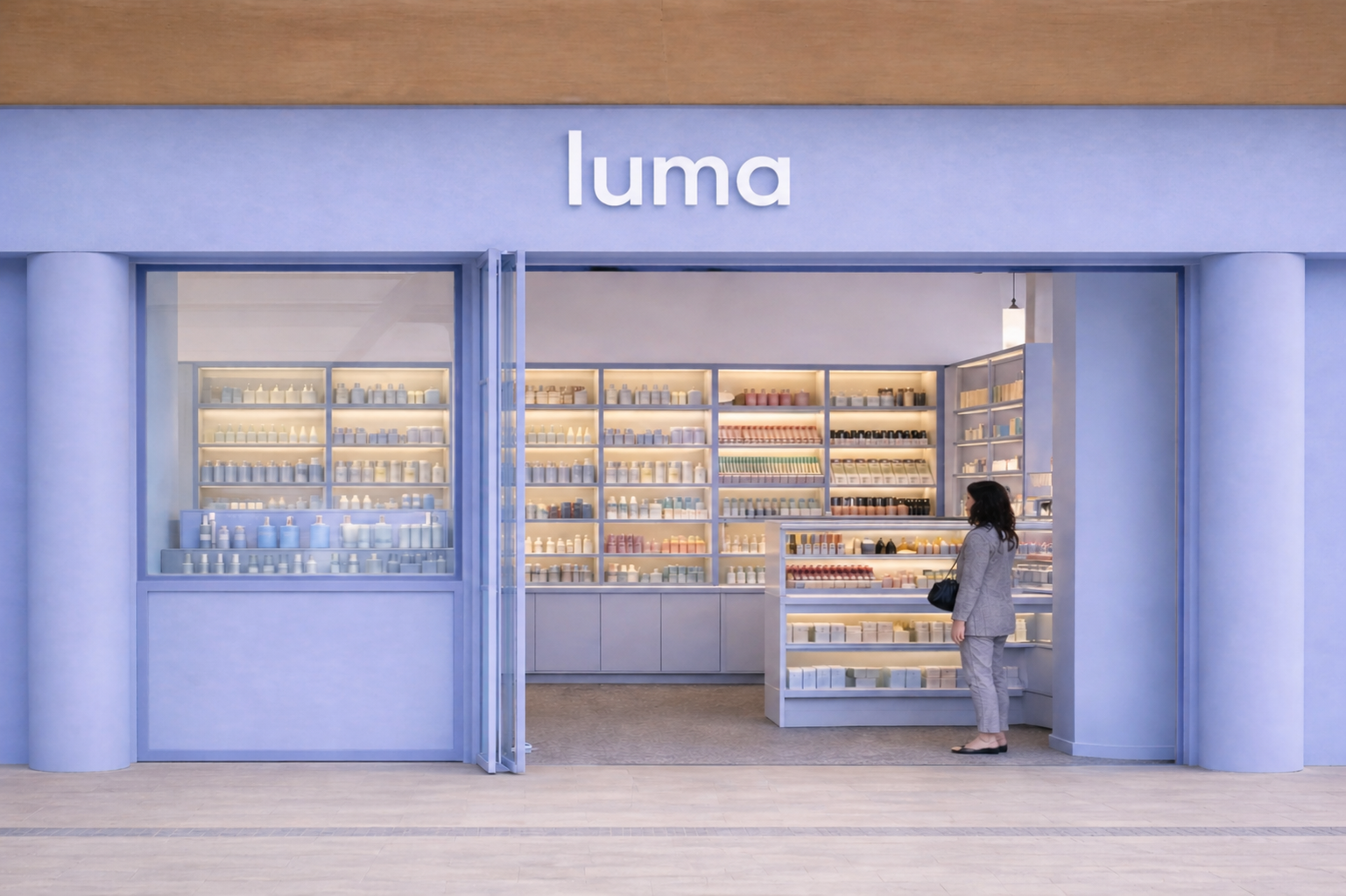 Front view of a store named 'Luma' with a woman browsing inside. The store has shelves filled with various skincare or cosmetic products in pastel colors, illuminated with soft lighting.