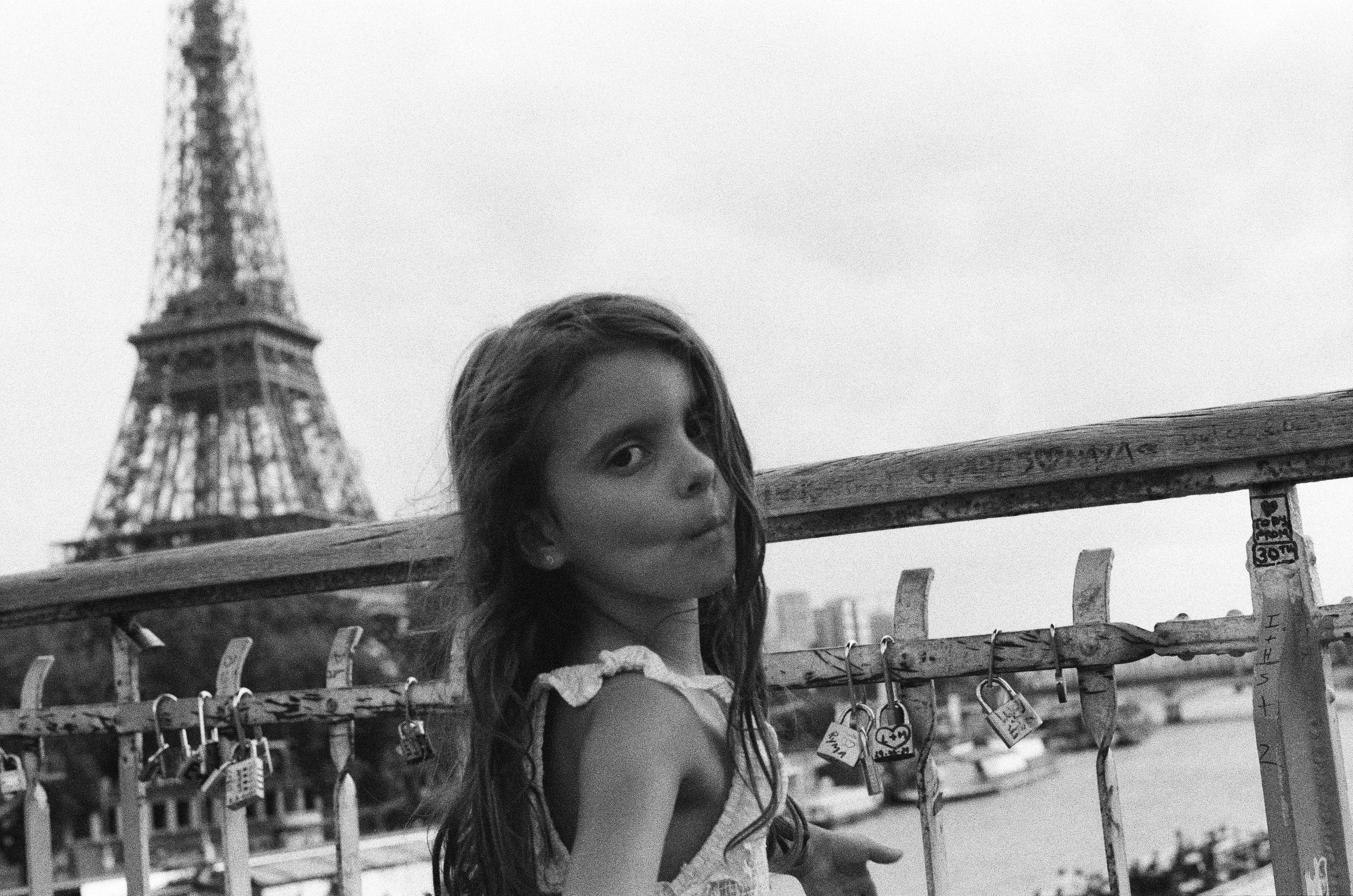 Girl on Parisian bridge exterior, analogue photograph