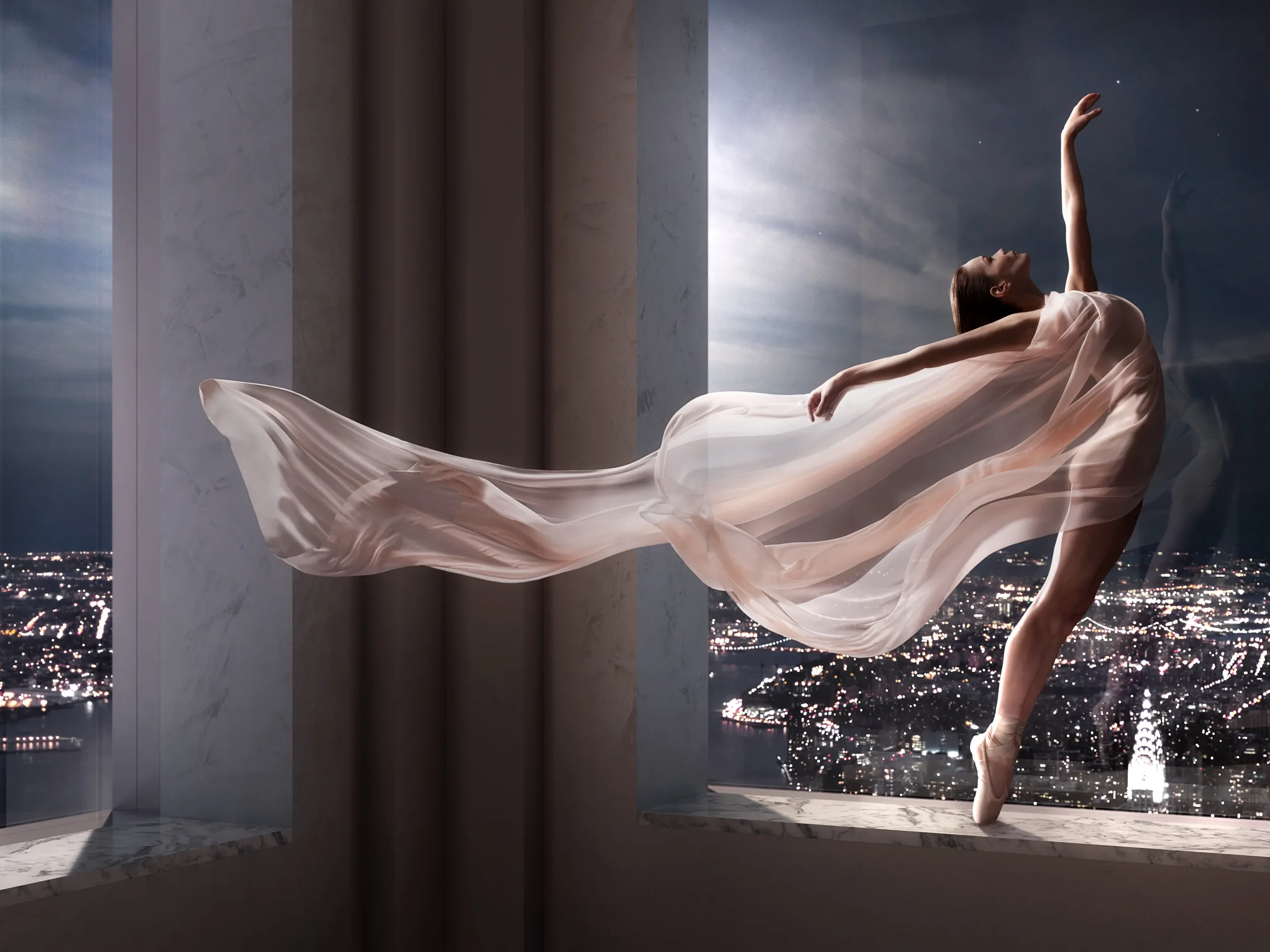 A ballerina in a flowing pink dress performs a dance pose on a windowsill in a high-rise building, with a city skyline at night in the background.