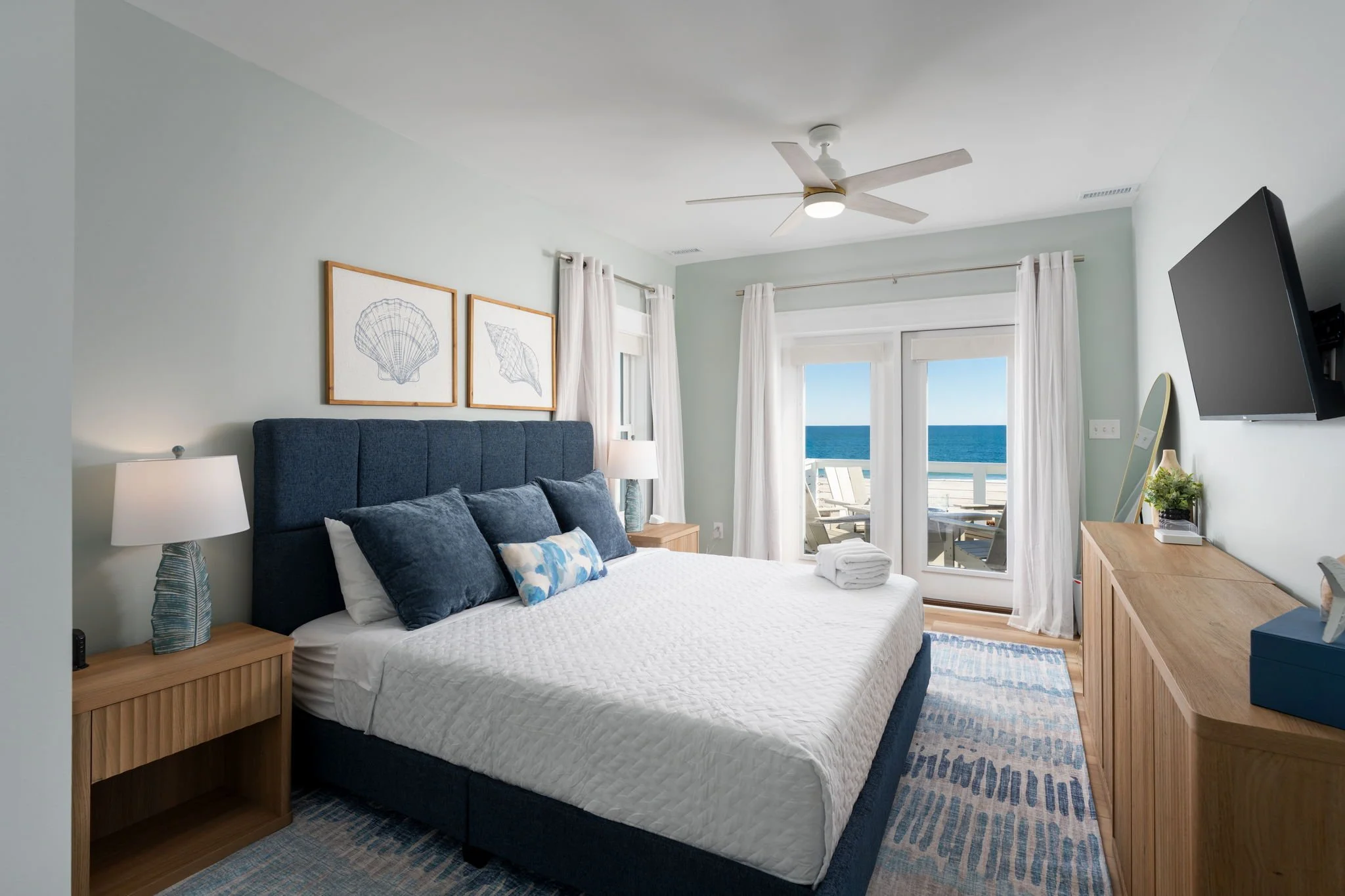 str-design-primary-bedroom-blue-upholstered-bed-carolina-beach-nc.jpg